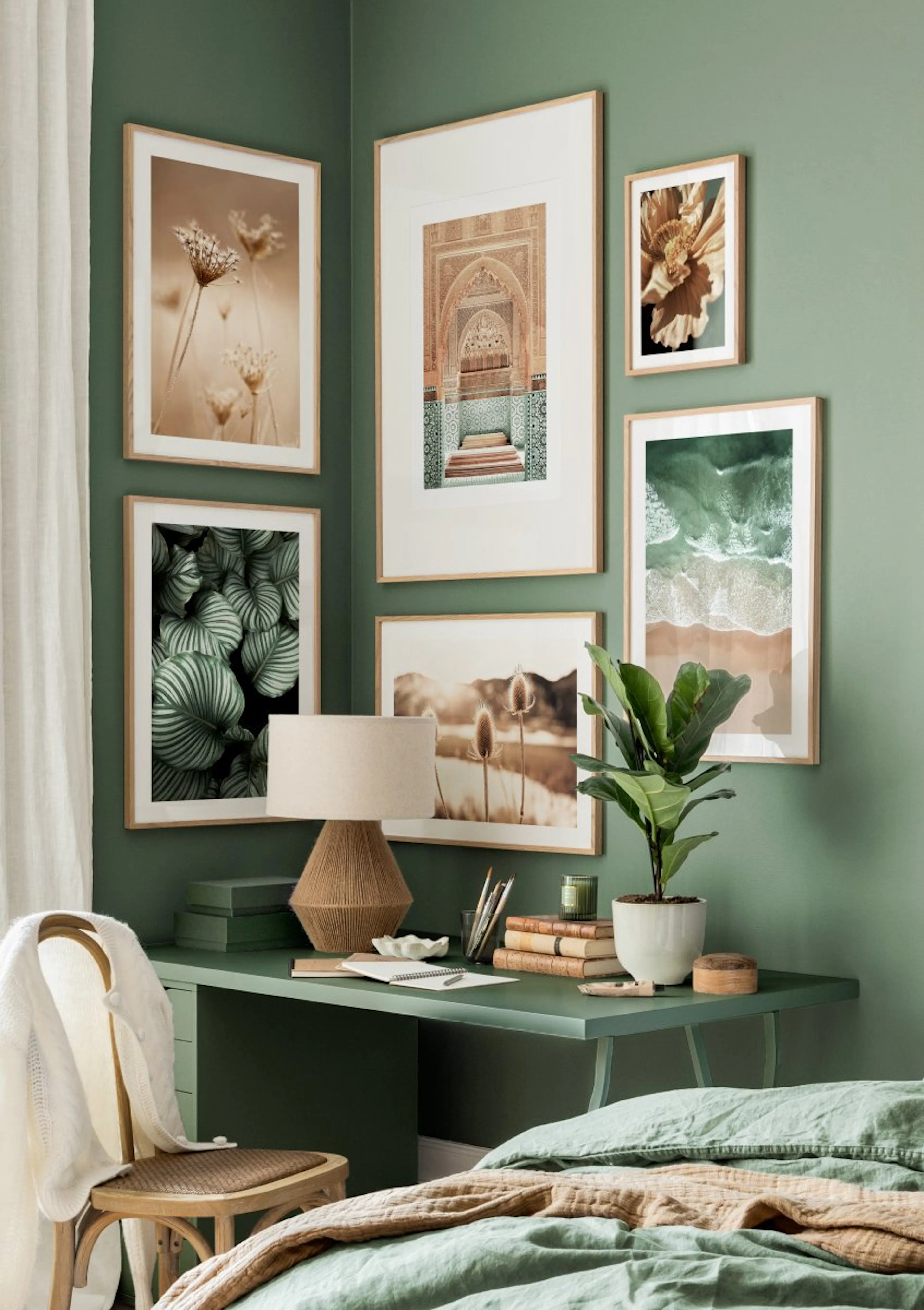 A gallery wall of nature-themed posters, including plants, flowers, a beach, and a Moroccan archway, displayed in a green bedroo