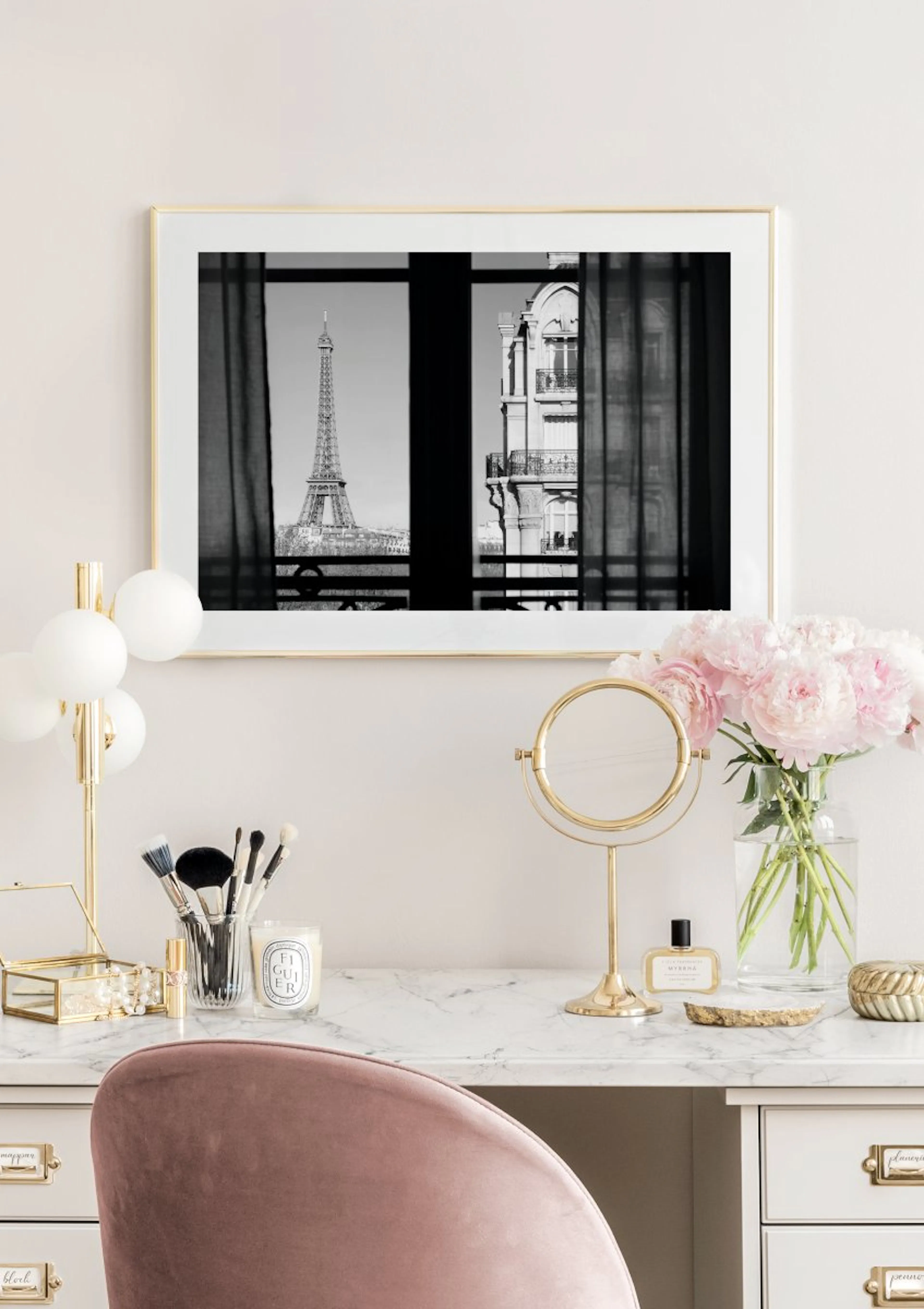 Black and white poster of the Eiffel Tower and a Parisian building viewed through a window, displayed above a white marble vanit