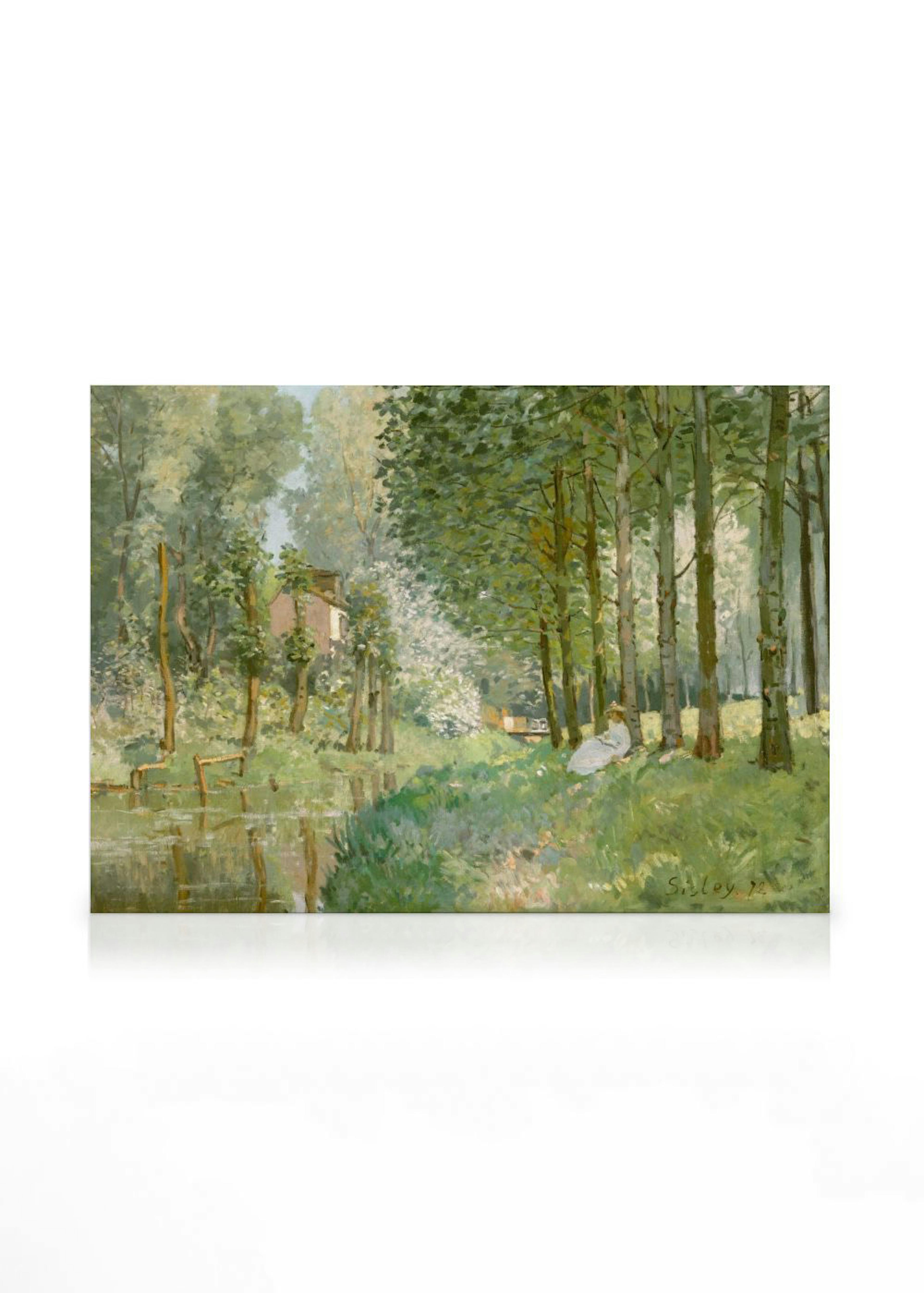 A landscape canvas print featuring a serene river scene with lush green trees, a distant house, and a person sitting by the wate