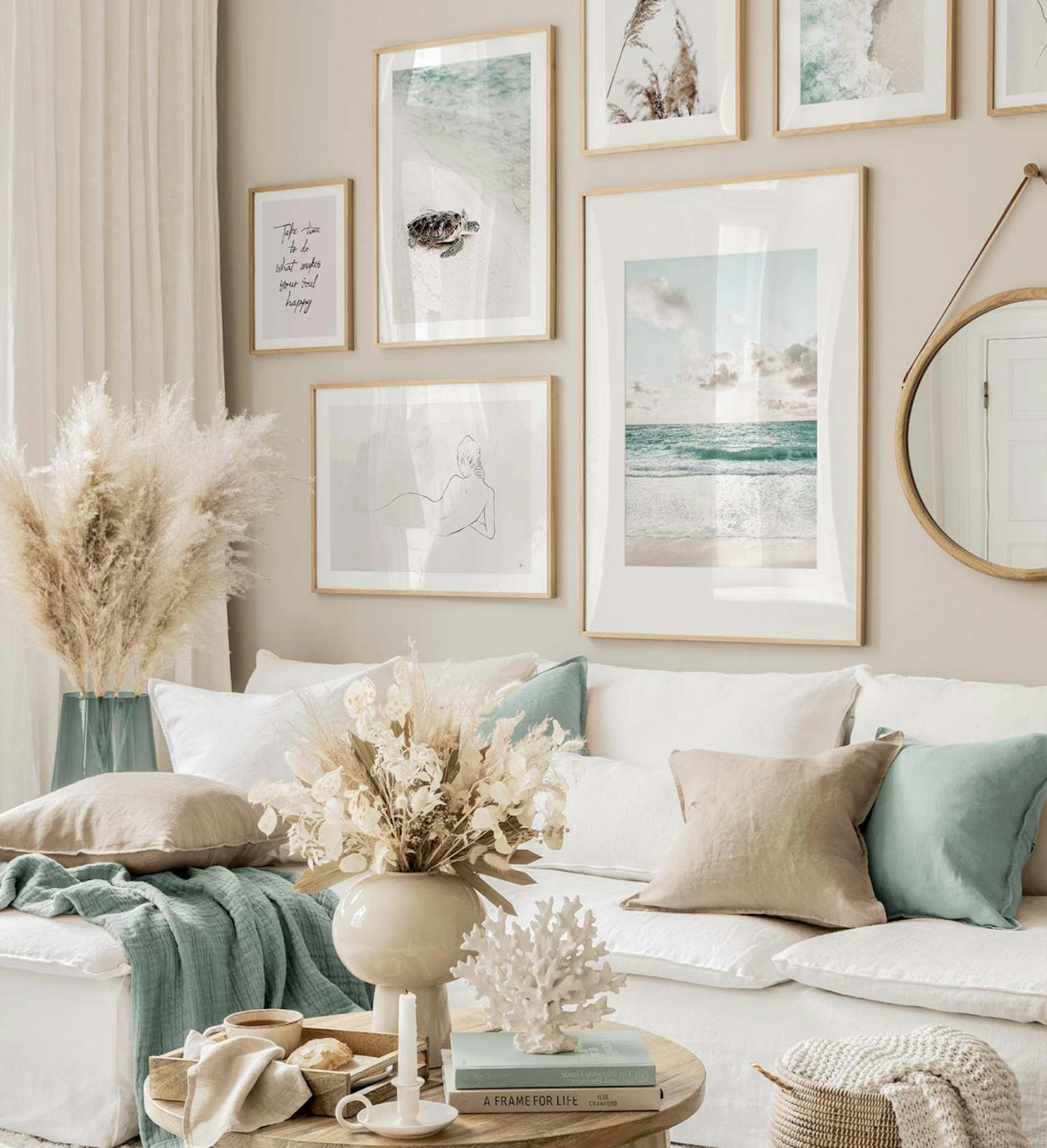 Classic and modern gallery wall with blue and beige tropical prints with oak frames for living room