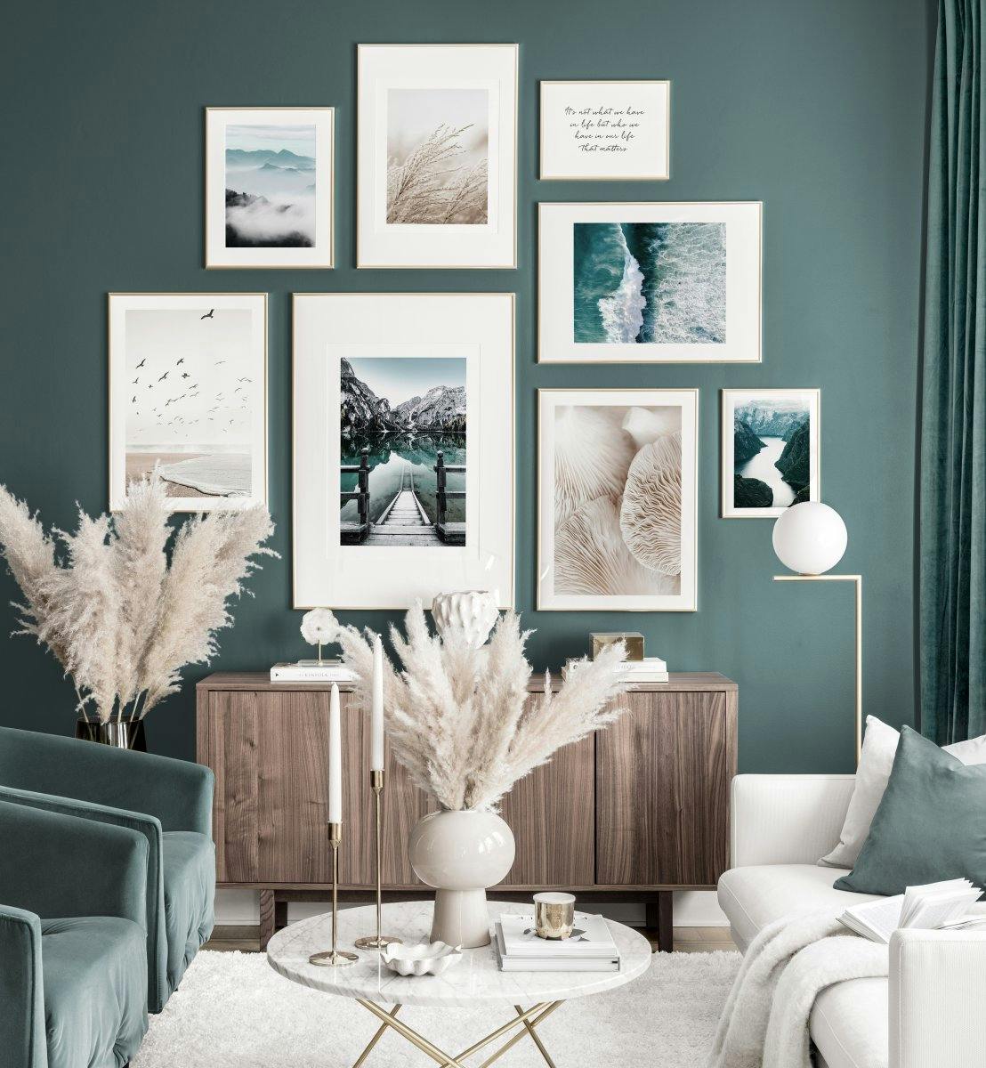 A gallery wall of posters featuring various nature scenes including mountains, a beach, water, and mushrooms, above a wooden cab