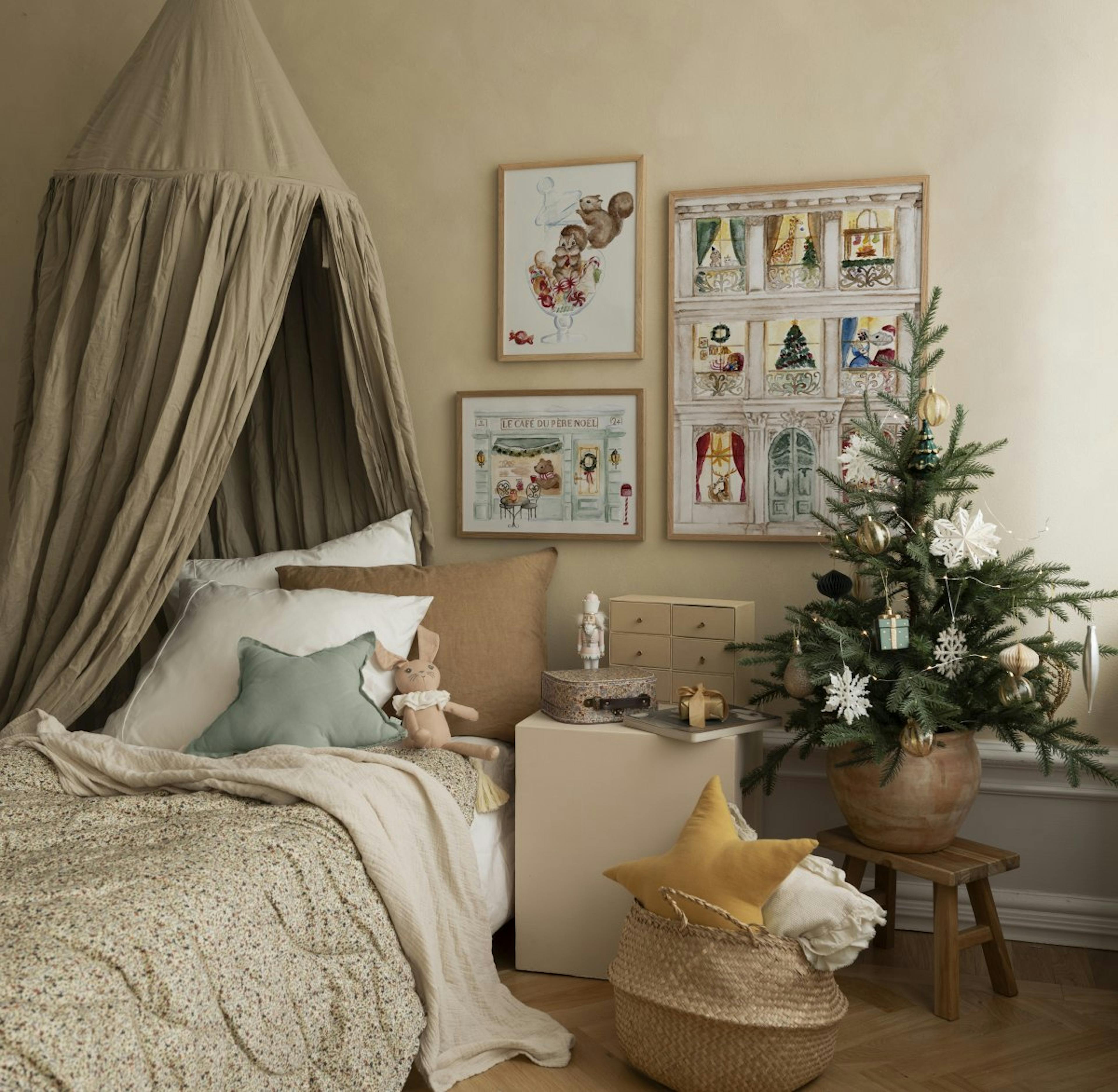 Festive Gallery Wall in oak frames, perfect for brightening up a child’s bedroom.