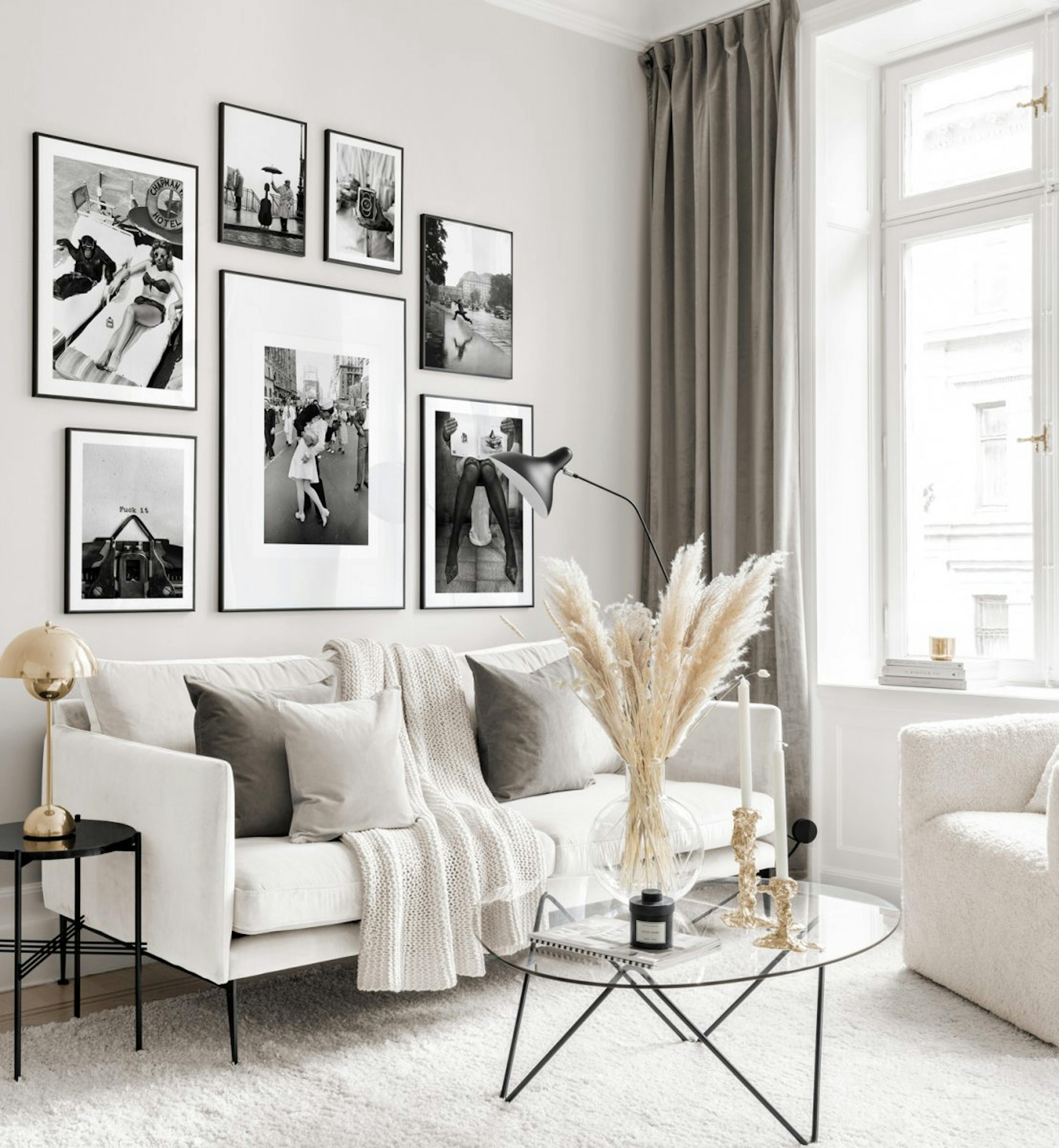 Black and white gallery wall with iconic posters in black metal frames