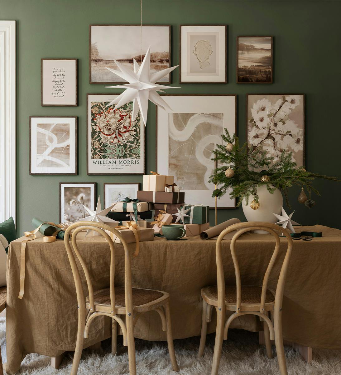 A poster featuring a vibrant floral pattern with red, green, and cream hues, showcasing William Morriss design.