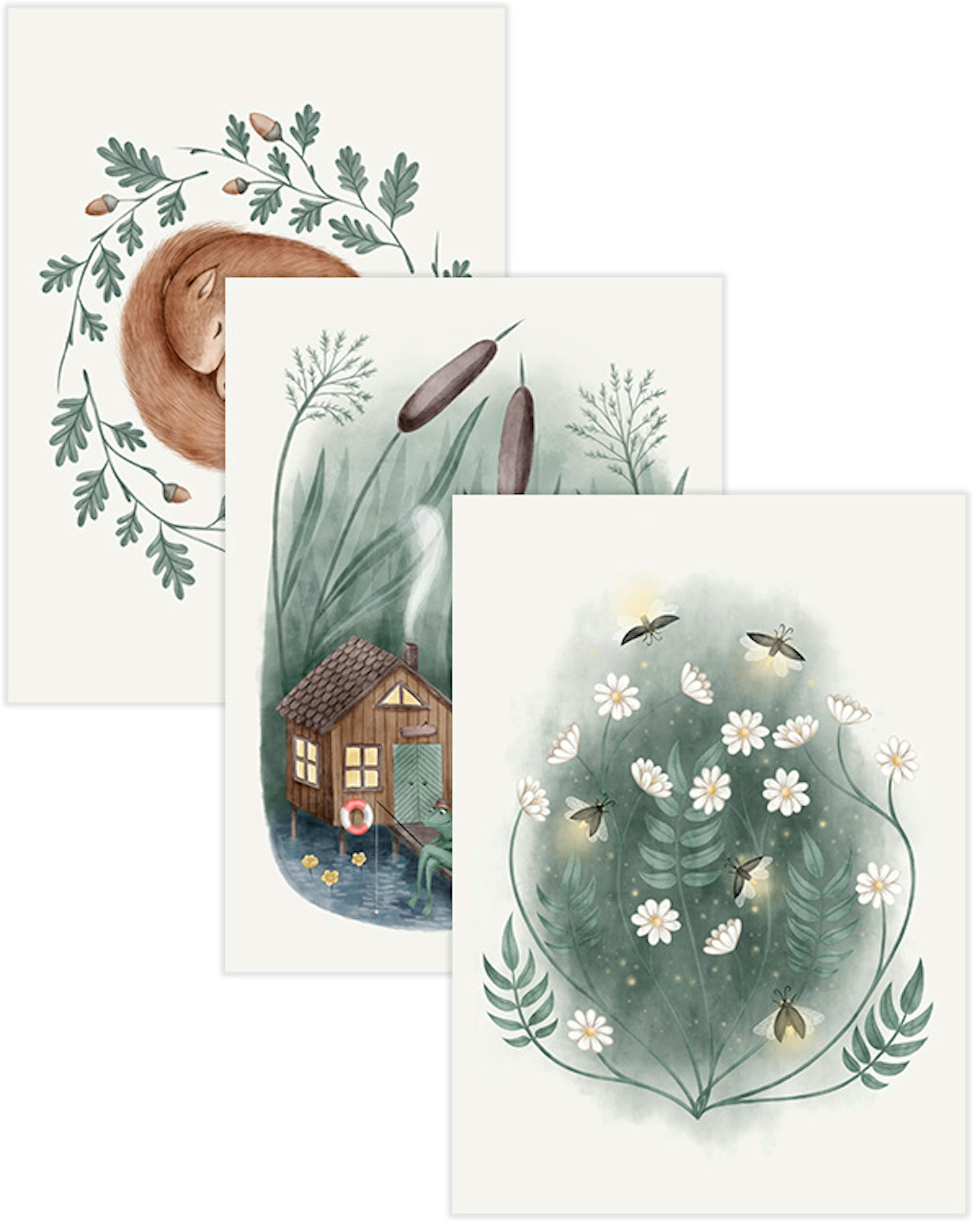 A poster pack of three whimsical prints: a sleeping fox in an oak wreath, a frog fishing from a lakeside cabin, and fireflies am