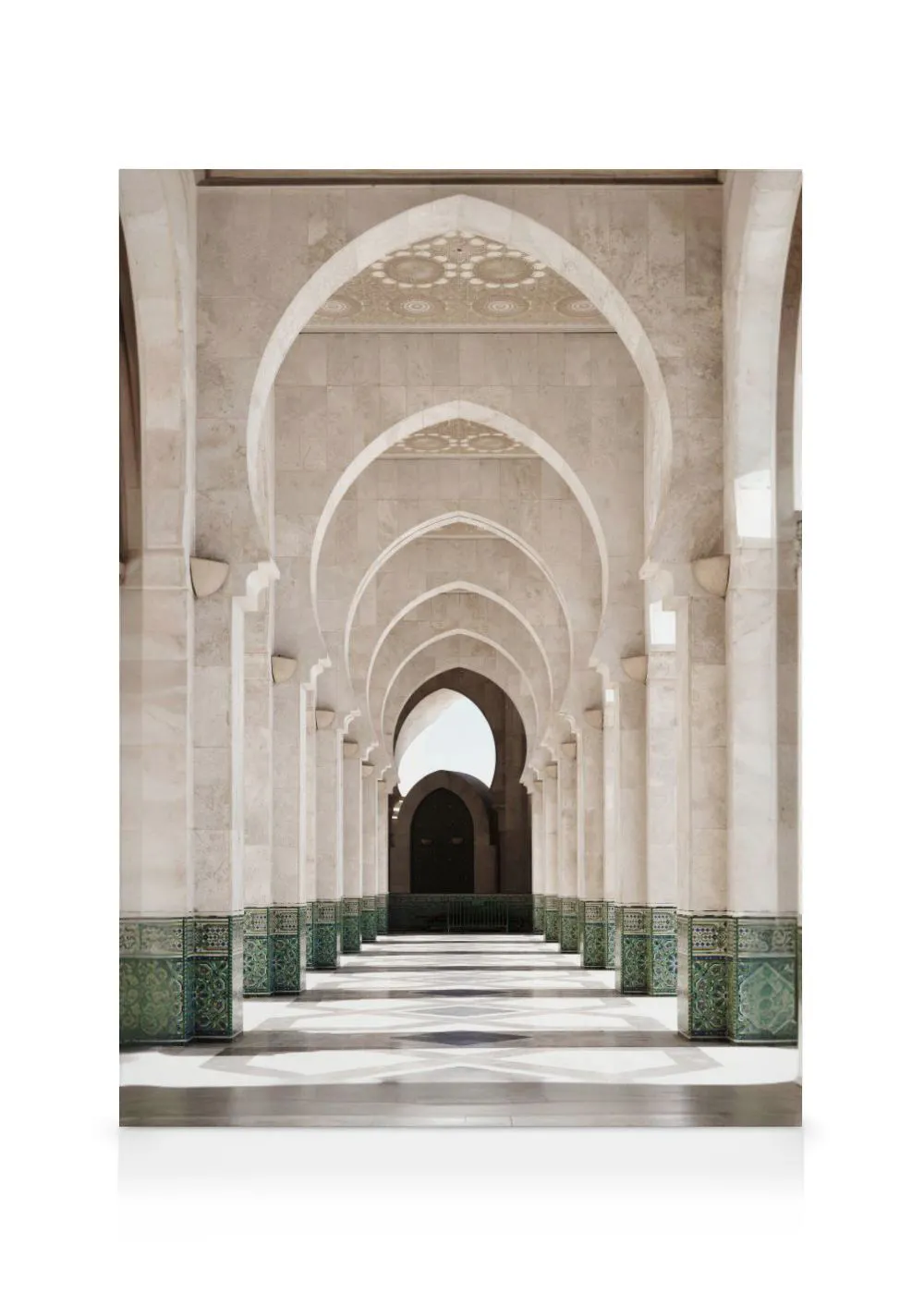 A canvas showing a long corridor of white stone arches and pillars with green patterned tiles along the base.