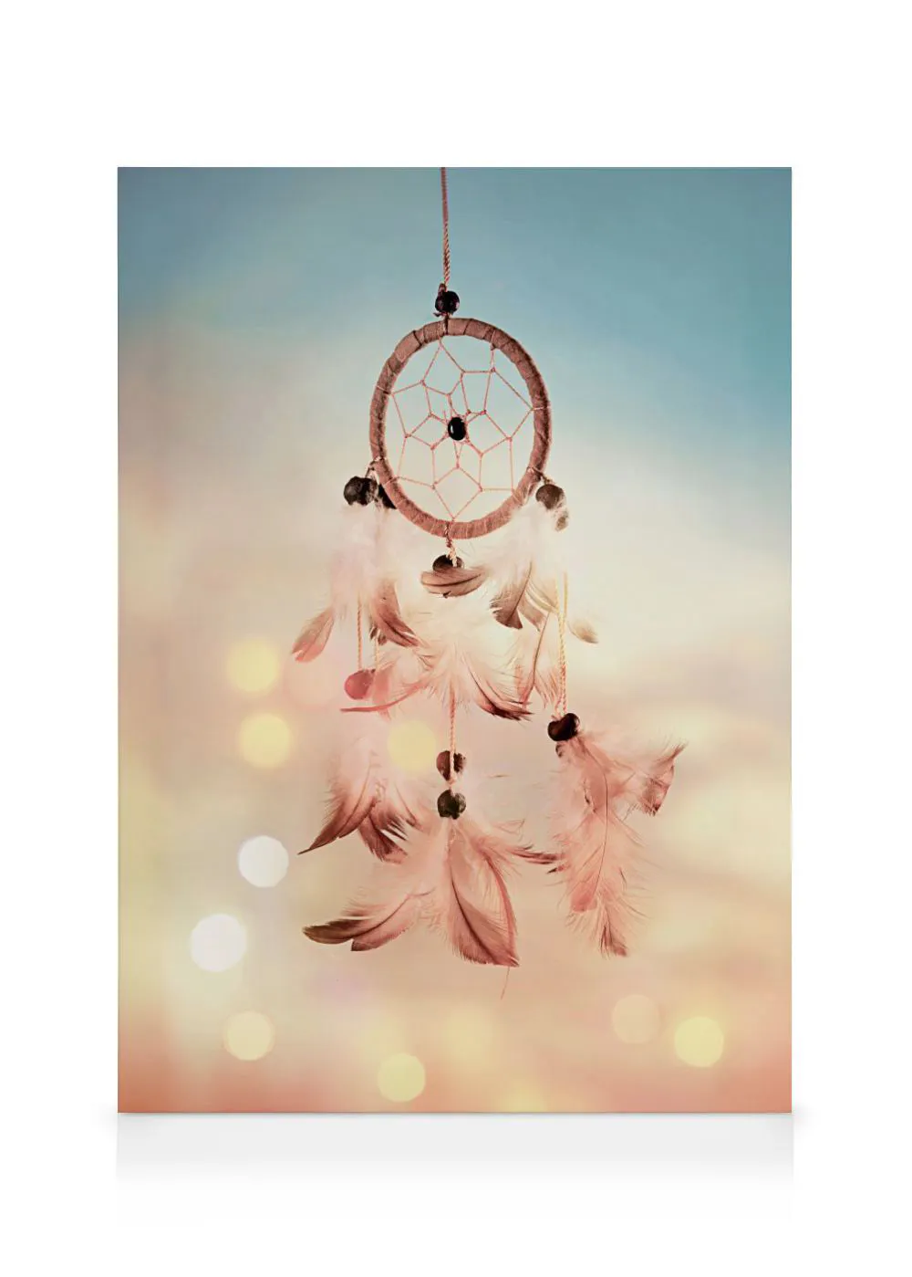 A dreamcatcher canvas featuring delicate feathers and beads, against a soft, bokeh-lit background.