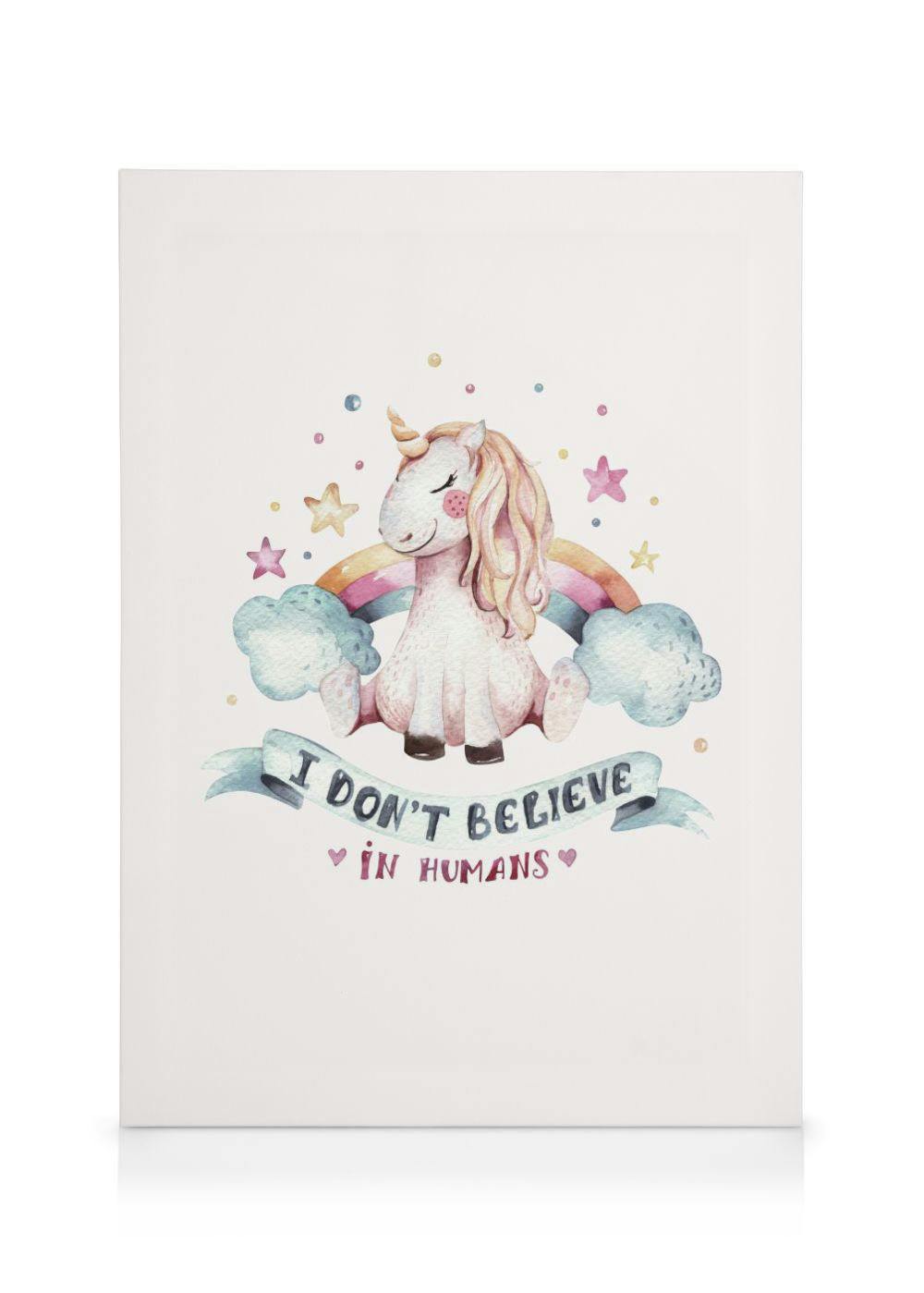 A cute unicorn canvas print with a rainbow and I Dont Believe in Humans text on a white background.