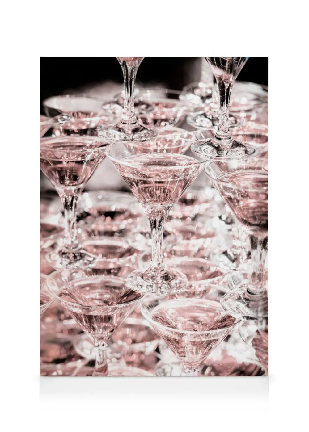 A canvas showing a stacked pyramid of martini glasses, each filled with a pale pink cocktail, for a celebratory feel.