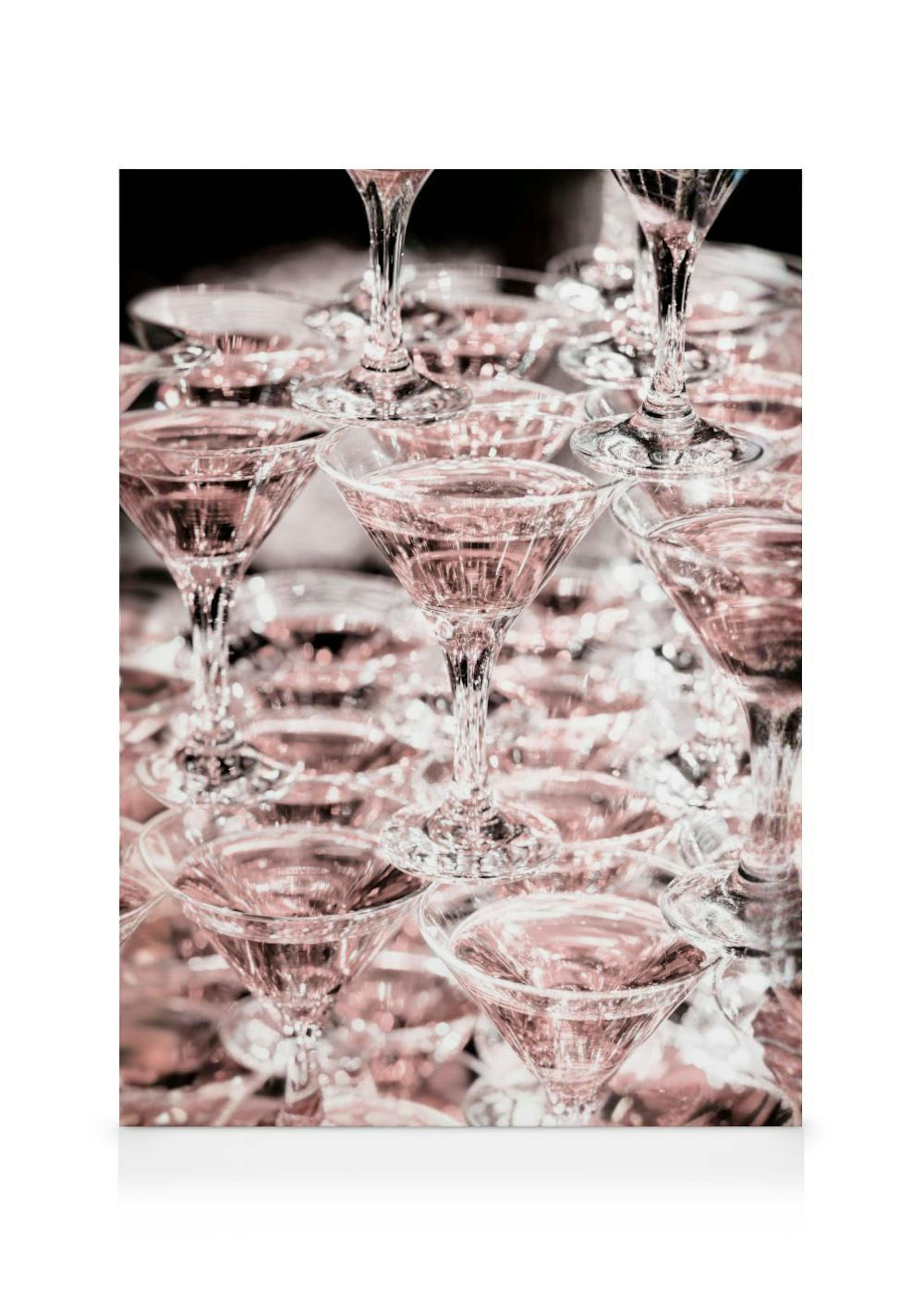 A canvas of a champagne tower with numerous martini glasses filled with pink liquid, stacked on top of each other.