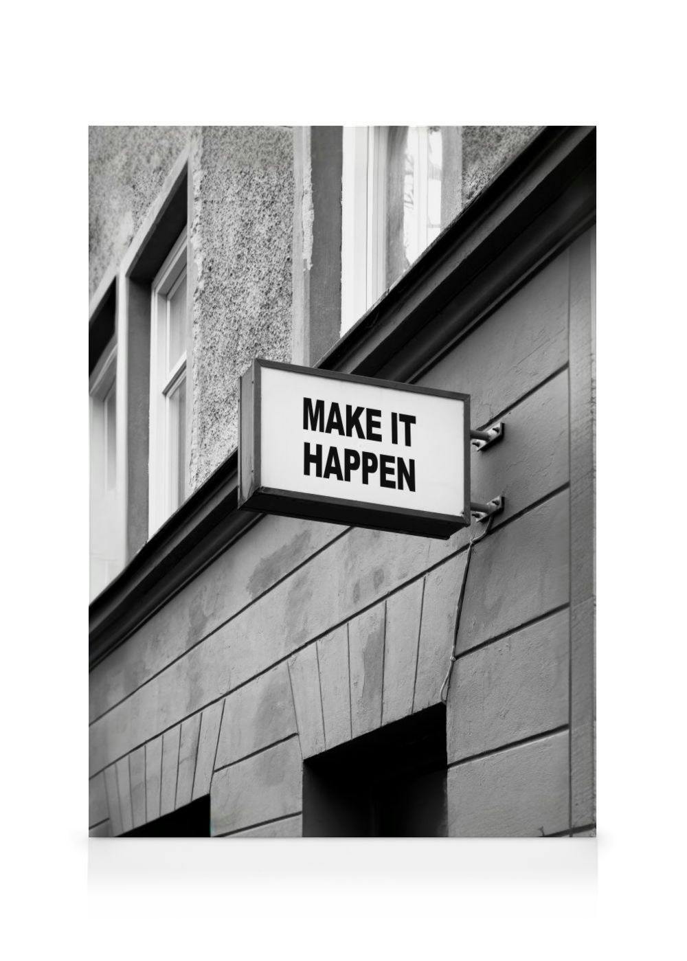 A black and white canvas featuring an outdoor sign that reads MAKE IT HAPPEN attached to a building.