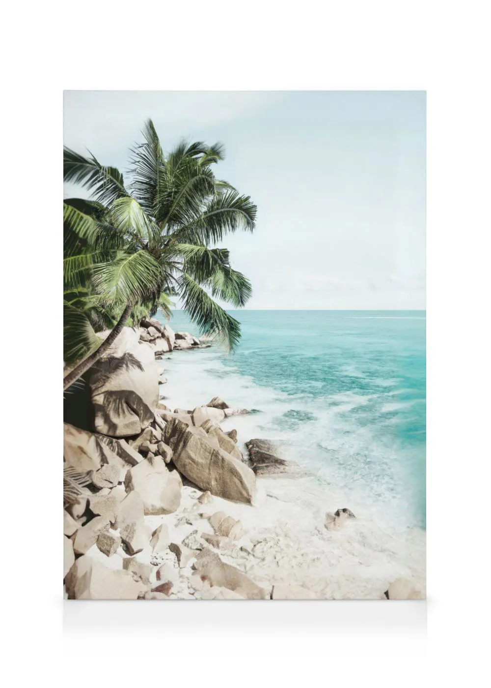 A canvas showing a vibrant turquoise ocean gently lapping against a rocky beach with a palm tree on the left.