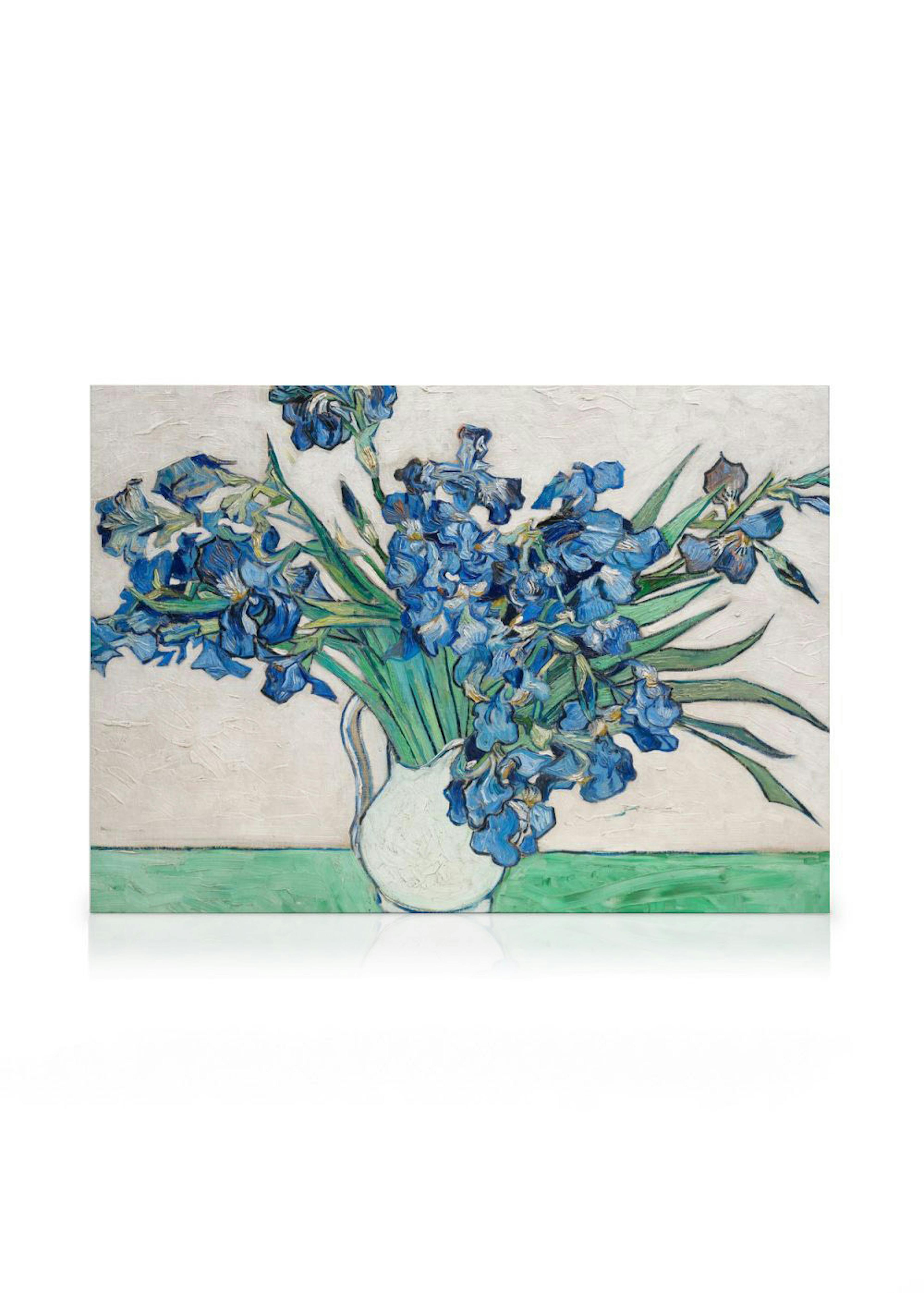 A canvas of Van Goghs Irises, a vibrant still life painting of blue irises in a white vase on a green surface.