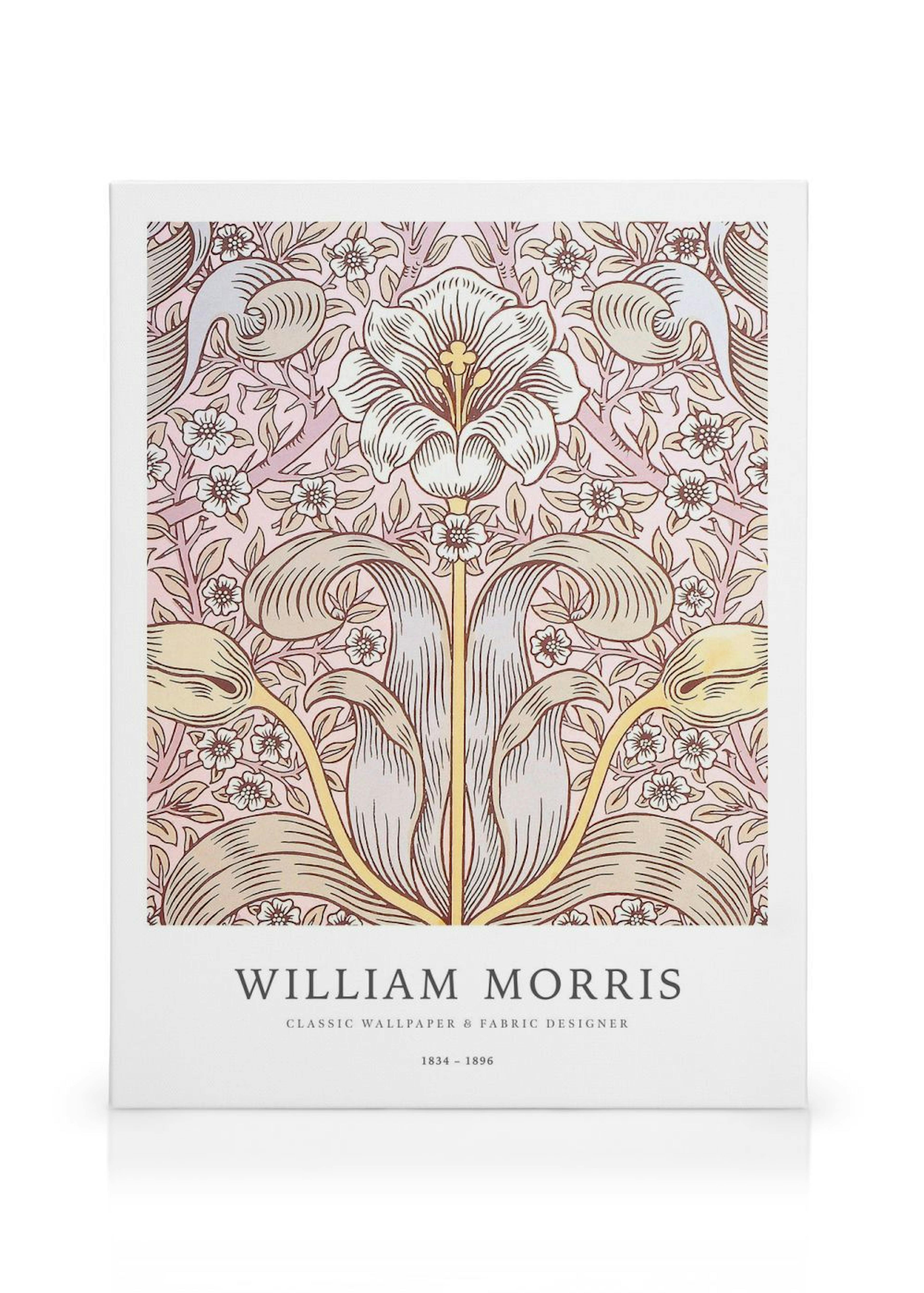 Vaaleanpunasävyinen William Morris -tyylinen kanvaasi, jossa toistuu valkoinen liljamainen kukka ja kasviaiheisia kuvioita.