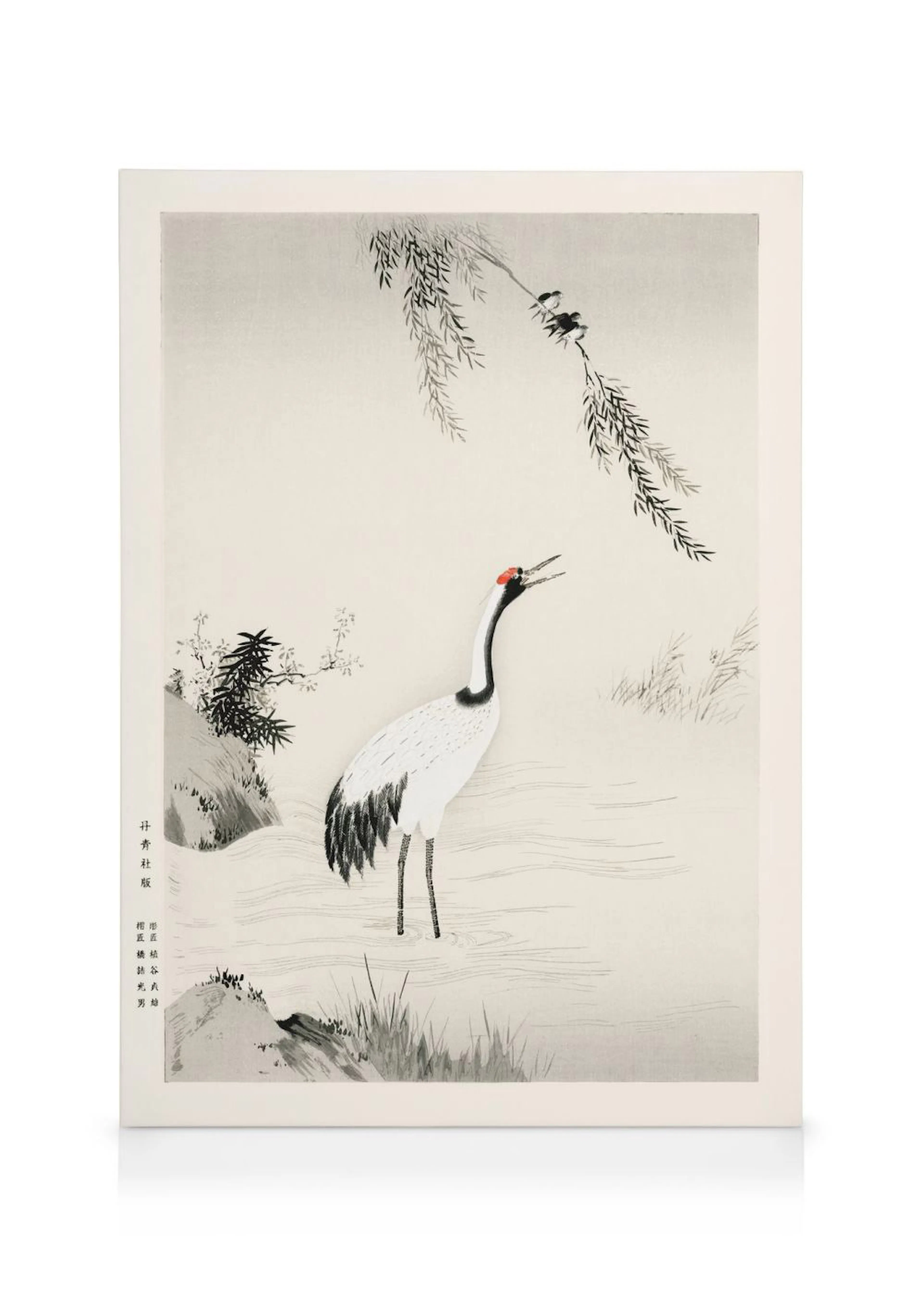 A canvas featuring a white and black crane with a red head standing in shallow water under a willow tree.
