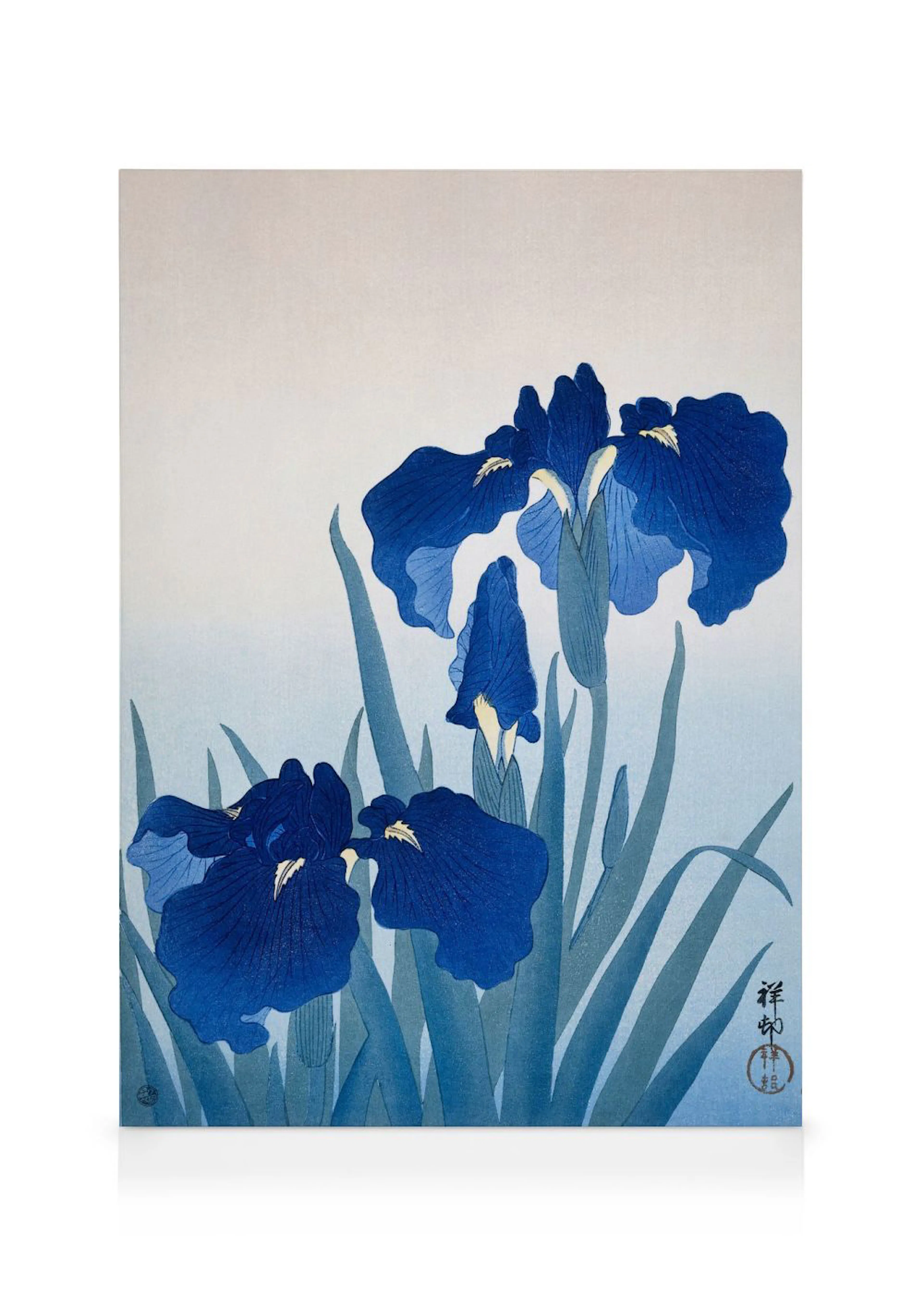 A canvas featuring a Japanese woodblock print of blue irises with green stems on a light blue background.