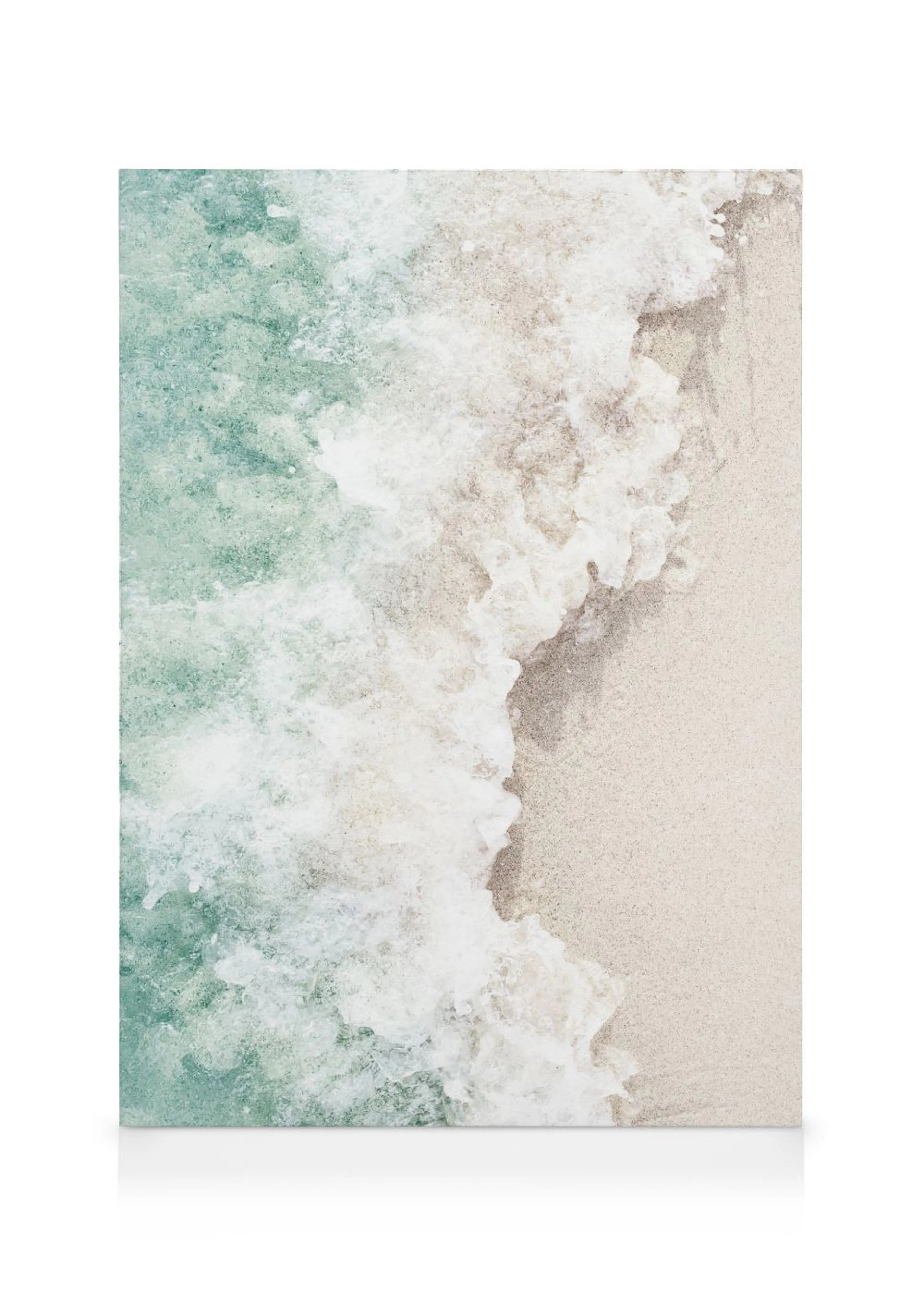 A canvas showing a serene beach scene with a foamy white wave washing onto light sand, next to turquoise ocean water.