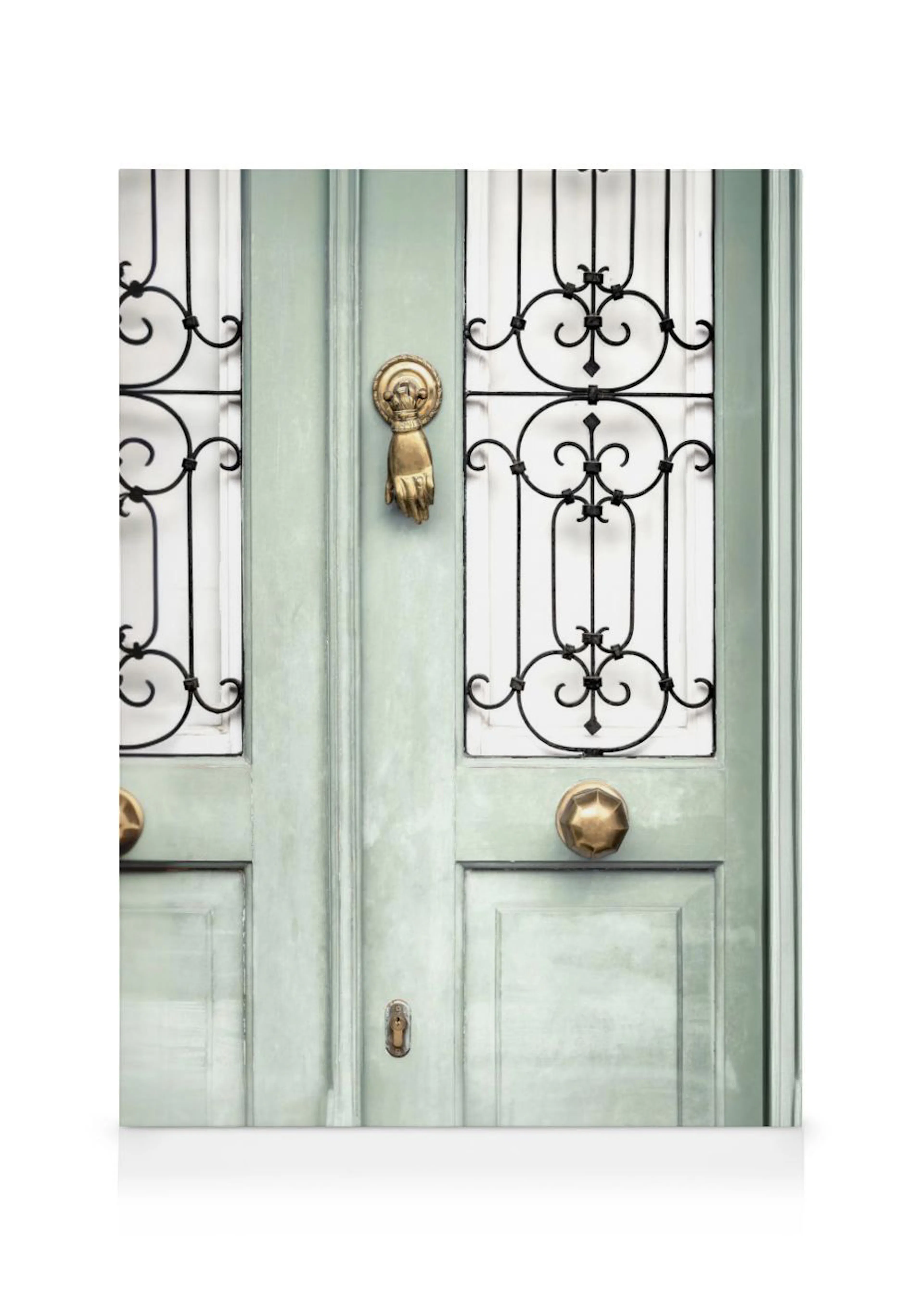 A canvas of a distressed antique teal door with black wrought iron grates and a brass hand-shaped knocker.