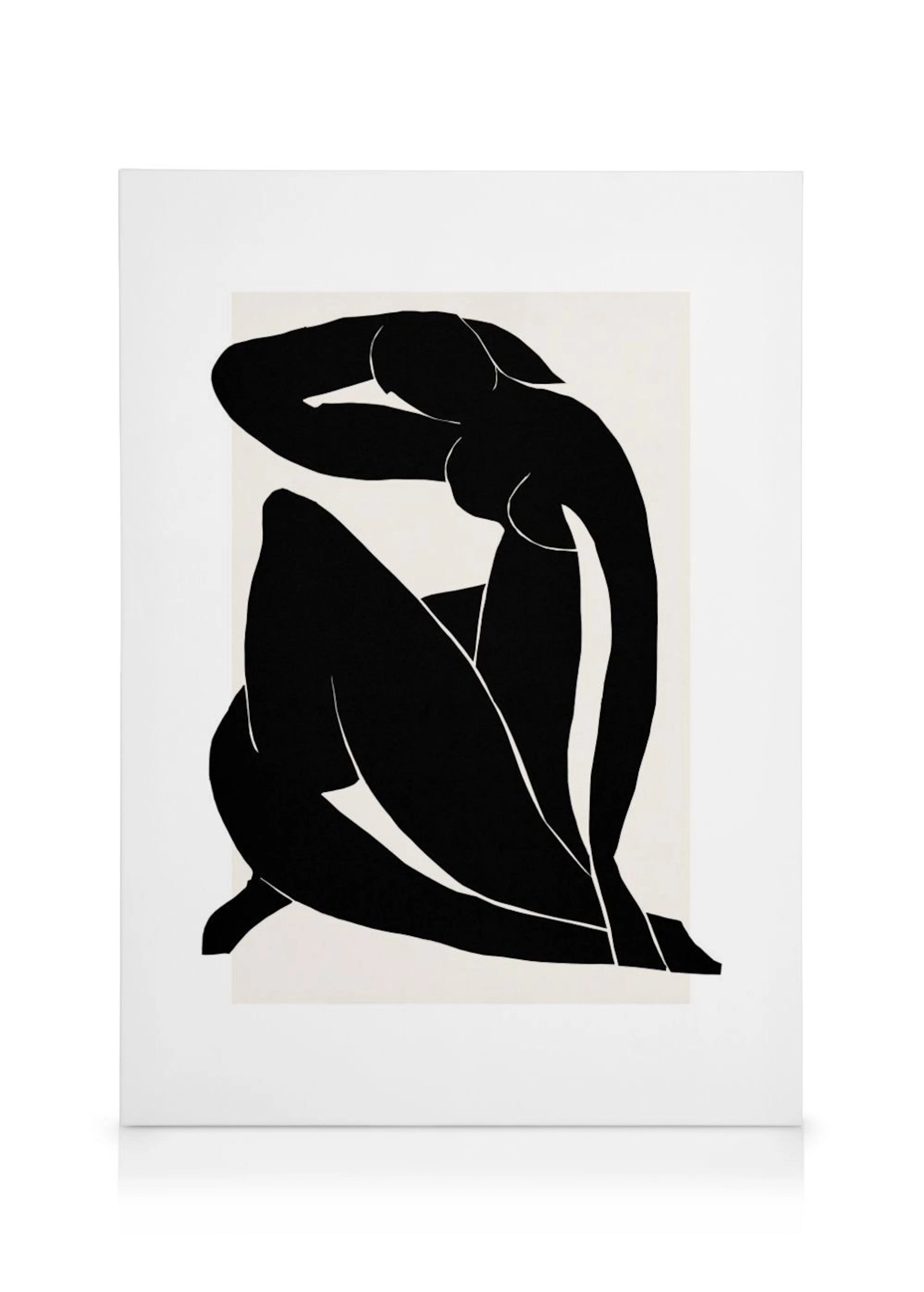 Toile murale, figure féminine assise en noir sur fond beige, style découpe moderne.