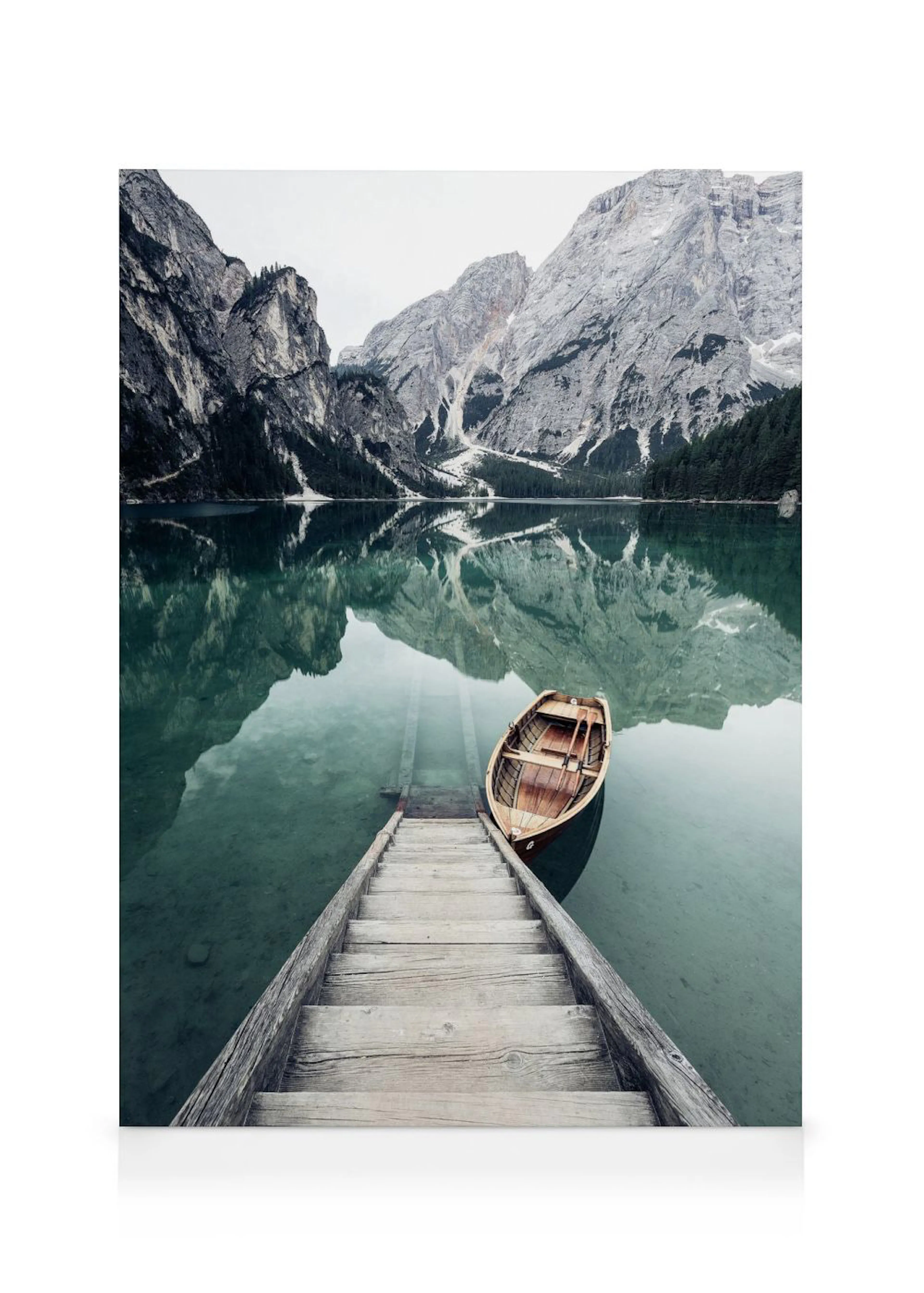 A canvas showing a wooden rowboat on a clear lake, with a dock extending into the water and mountains reflecting in the backgrou