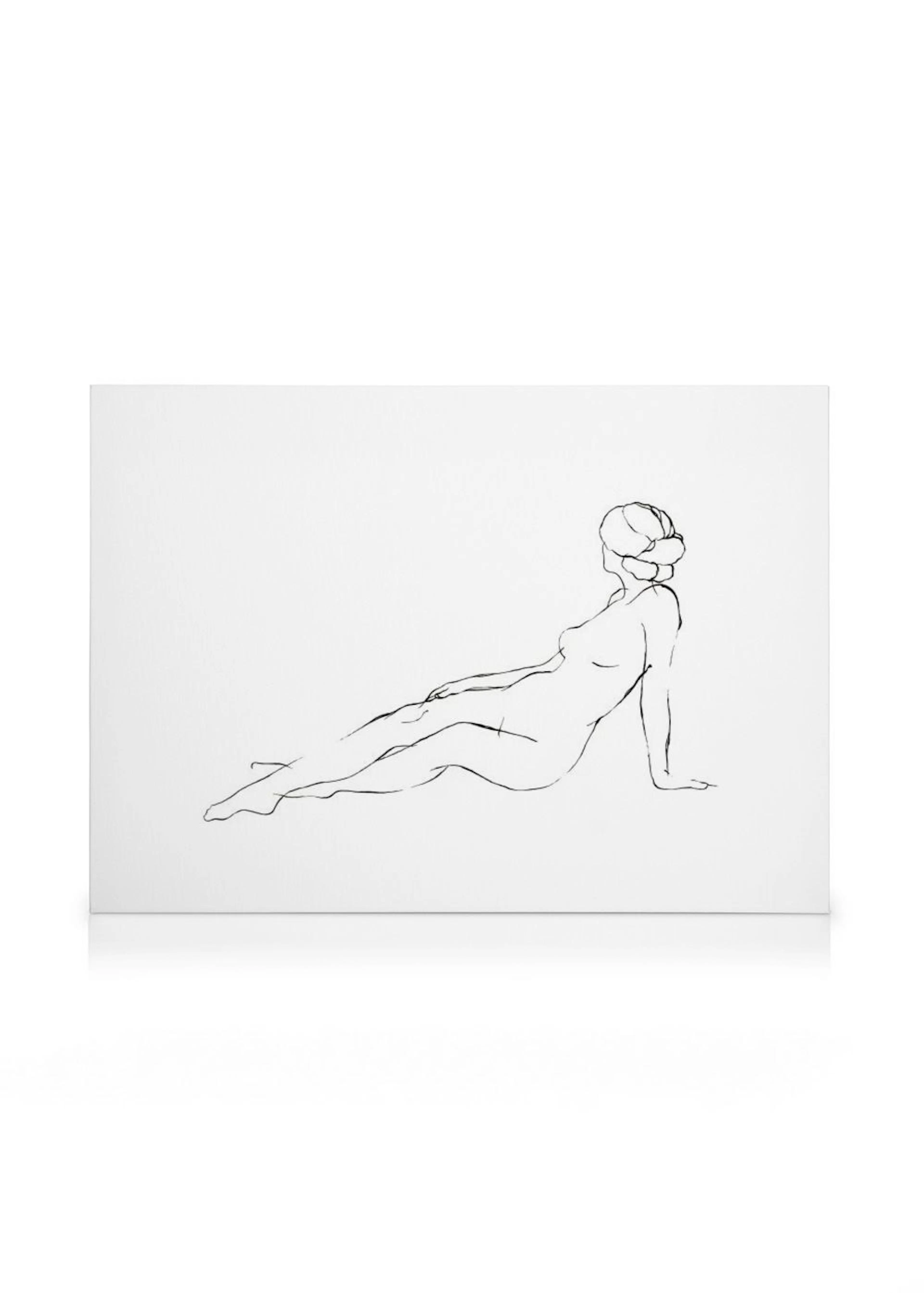 Lienzo blanco con un dibujo de figura femenina reclinada, de perfil, en trazo continuo negro.