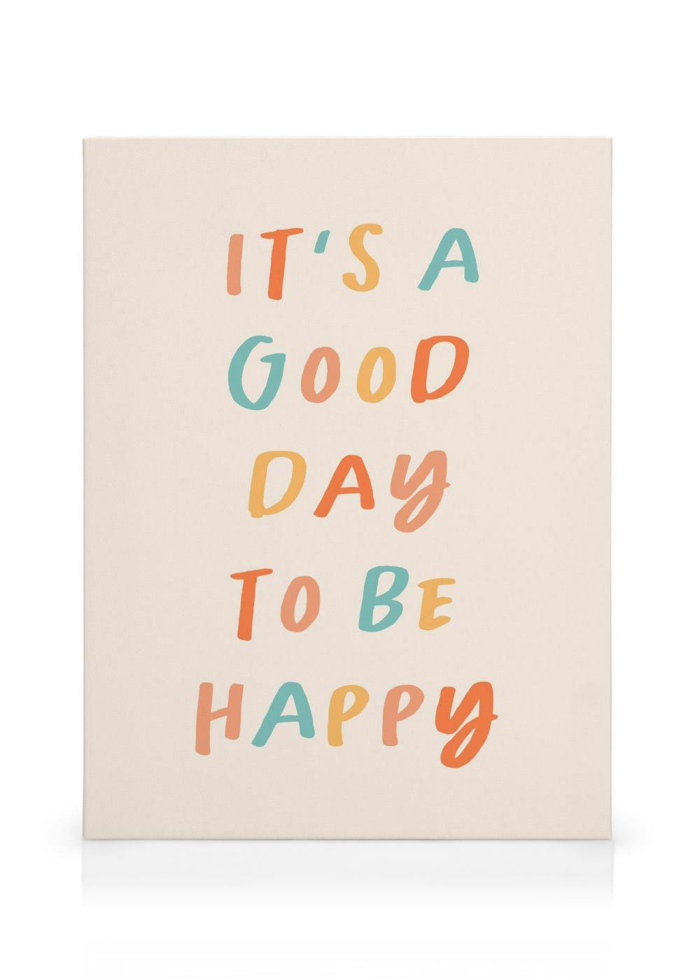 Canvastavla med texten ITS A GOOD DAY TO BE HAPPY i färgglada bokstäver på en ljus bakgrund.