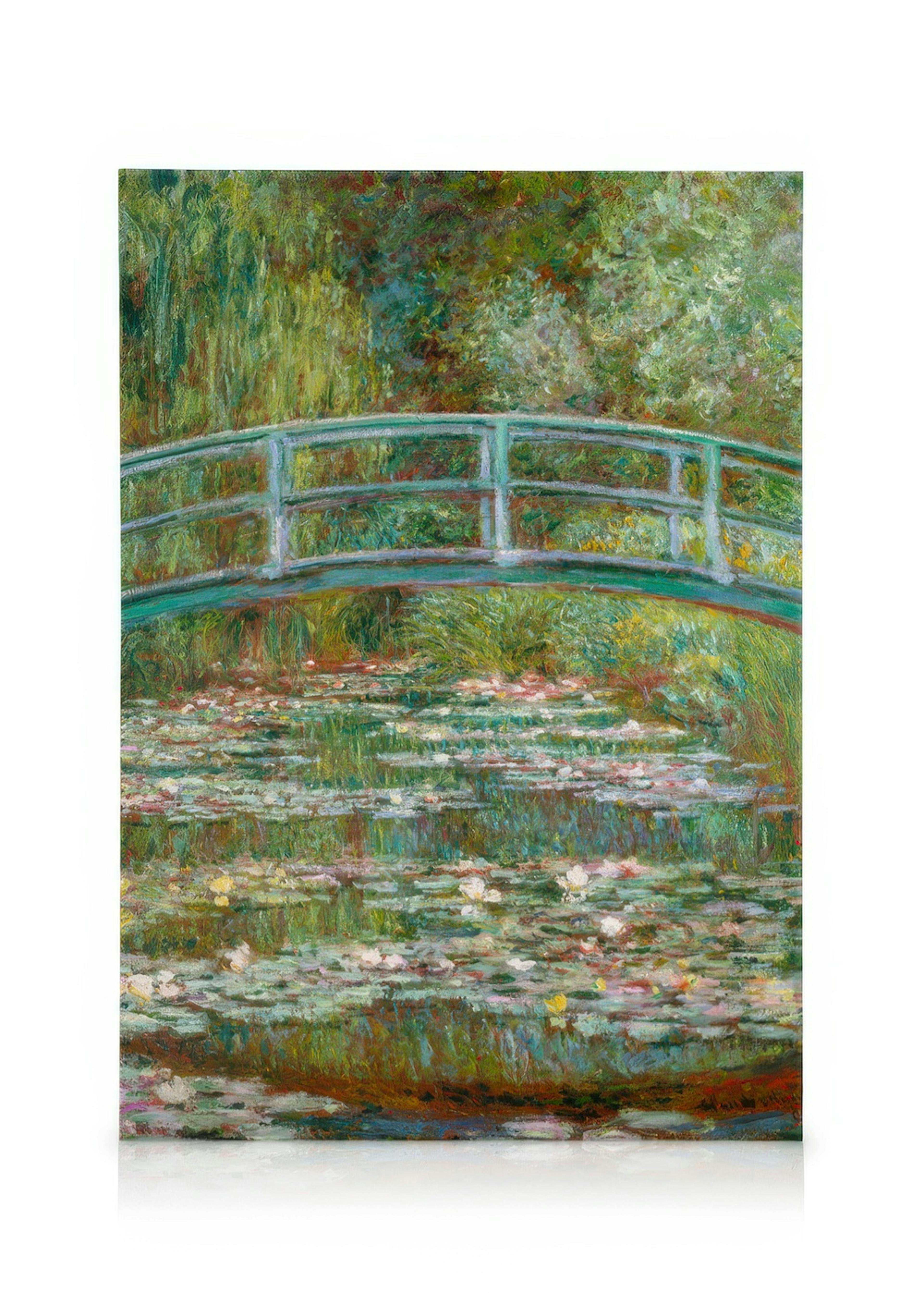 Stampa su tela del Ponte giapponese di Monet, con ninfee e un ponte verde che attraversa un laghetto.