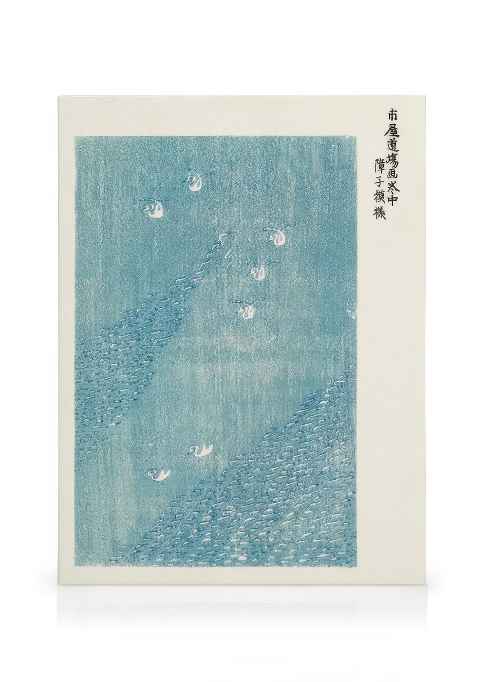A canvas showing a pale blue Japanese woodblock print with white birds flying over a textured blue landscape.