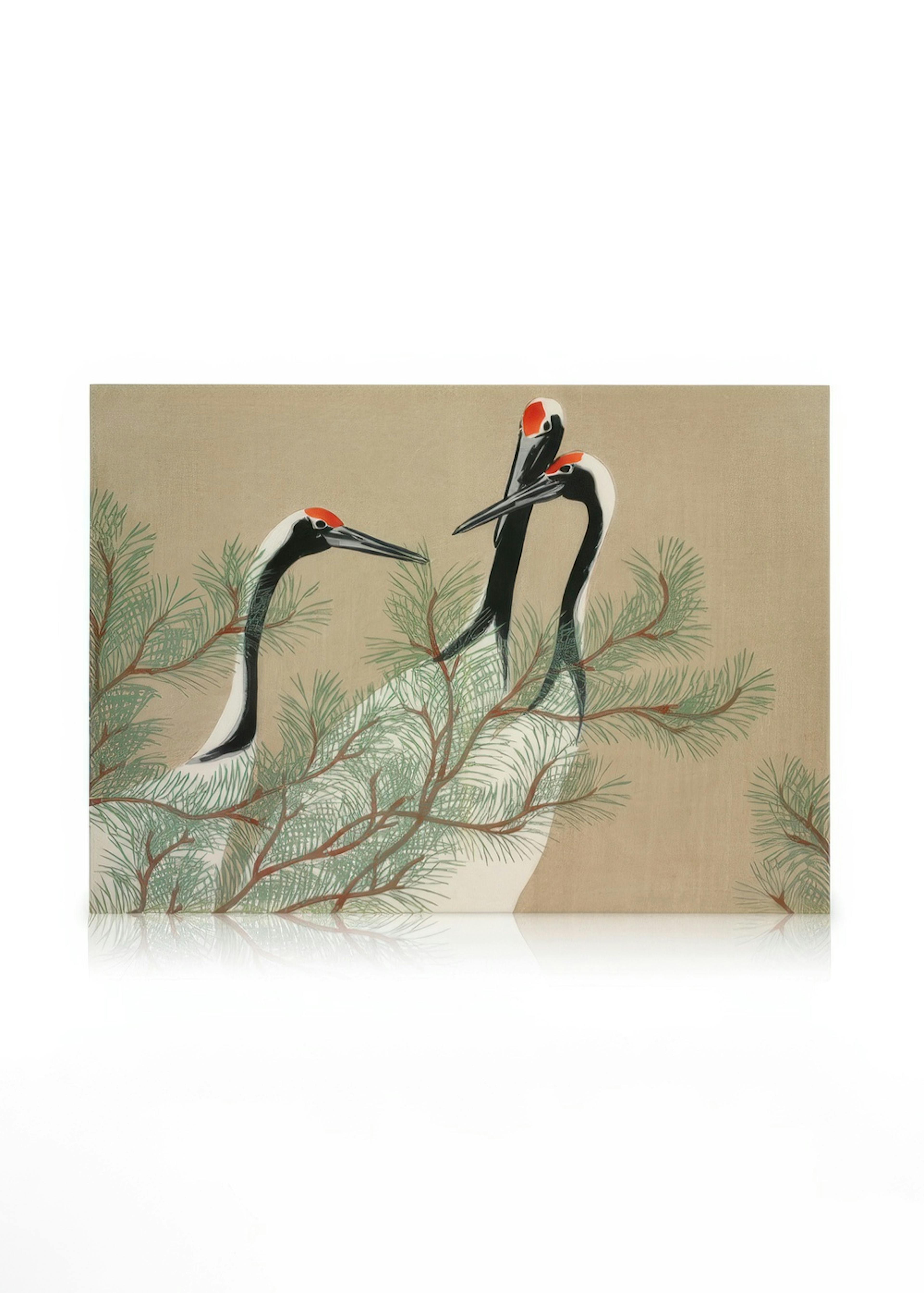 A canvas featuring three white cranes with black necks and red heads among green pine branches on a beige background.
