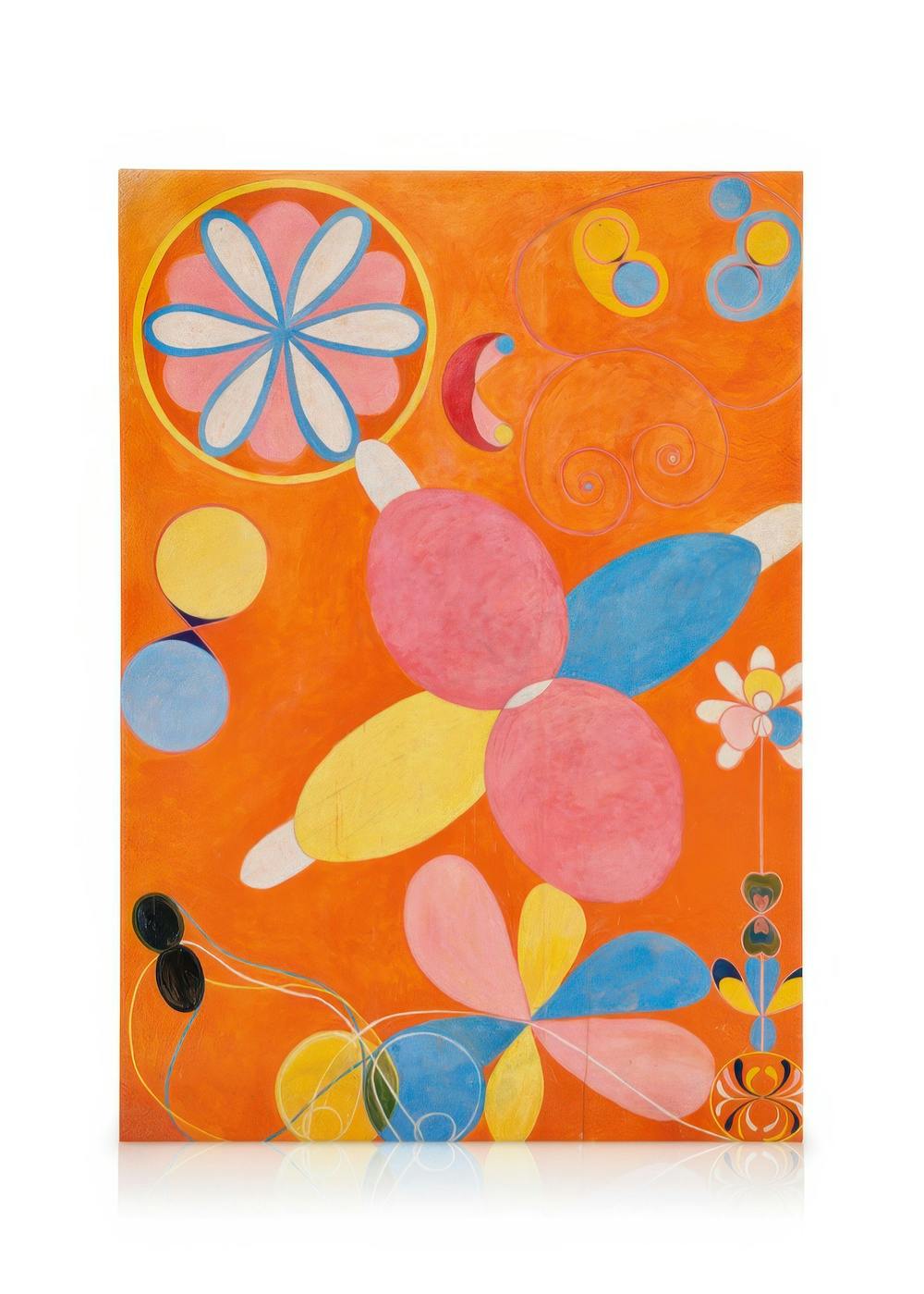 Obraz na płótnie przedstawiający abstrakcyjną kompozycję z różowymi, niebieskimi i żółtymi kształtami na pomarańczowym tle.