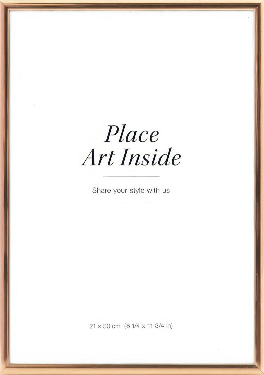 A poster with a rose gold frame and white background, featuring the text Place Art Inside in black script.