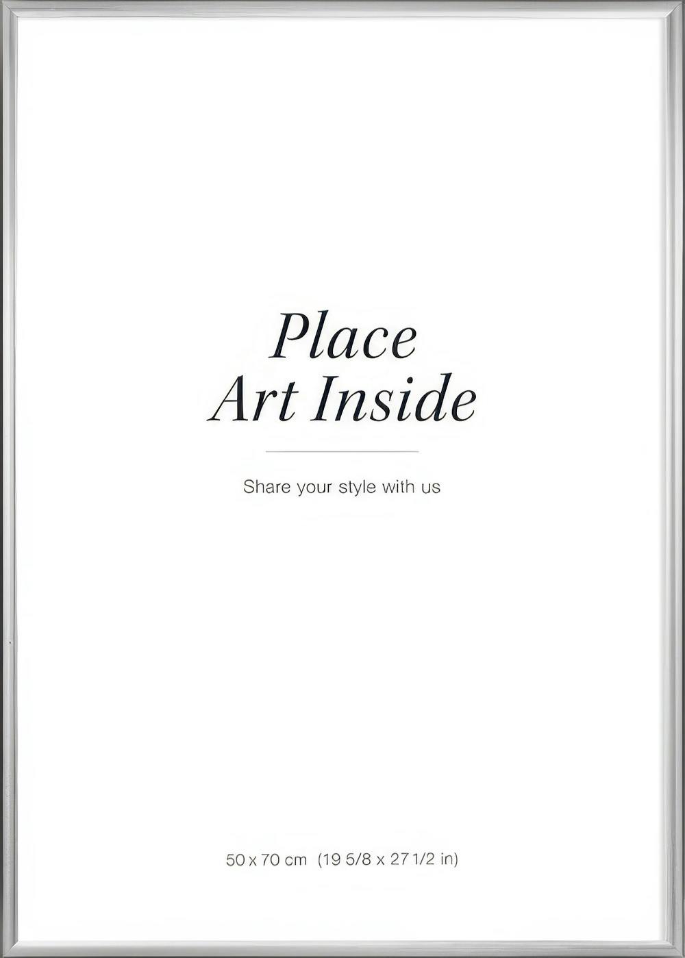 A poster with a white background and the text Place Art Inside and Share your style with us in elegant black font.