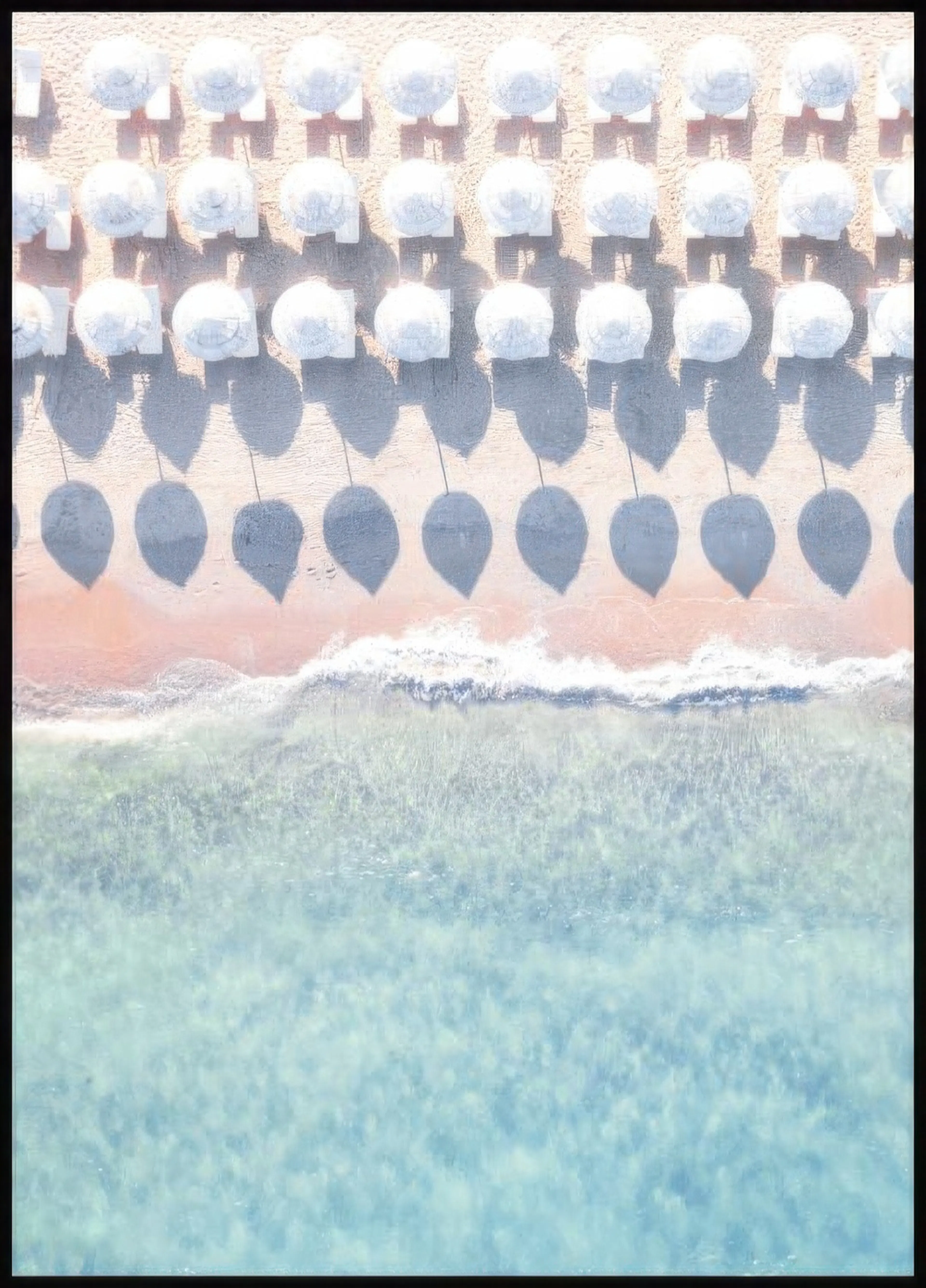 A poster featuring an aerial view of a pink sand beach with rows of white umbrellas casting long shadows onto the sand, meeting 