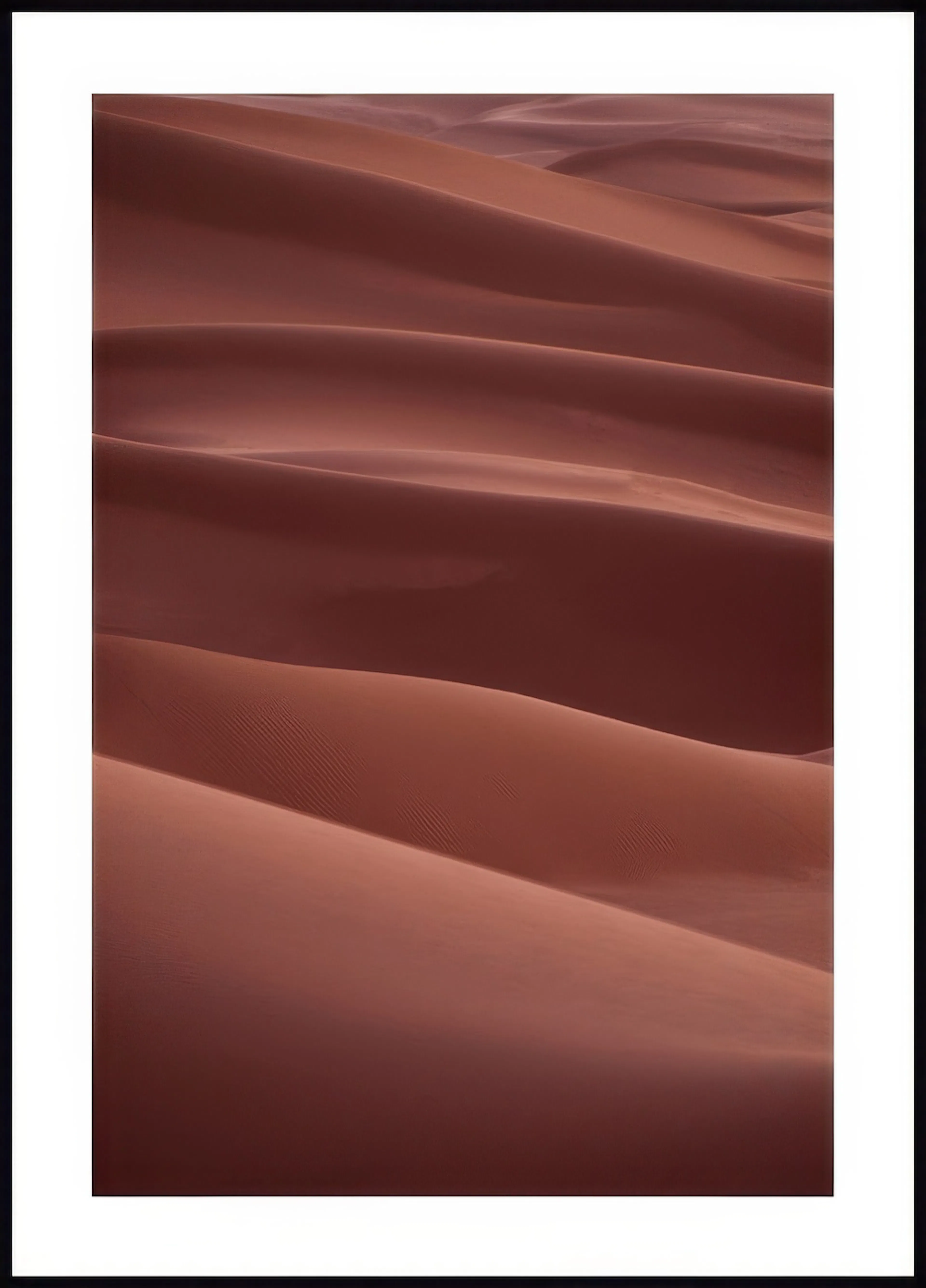 A poster featuring a close-up of flowing red-orange desert sand dunes with subtle shadows and textures.