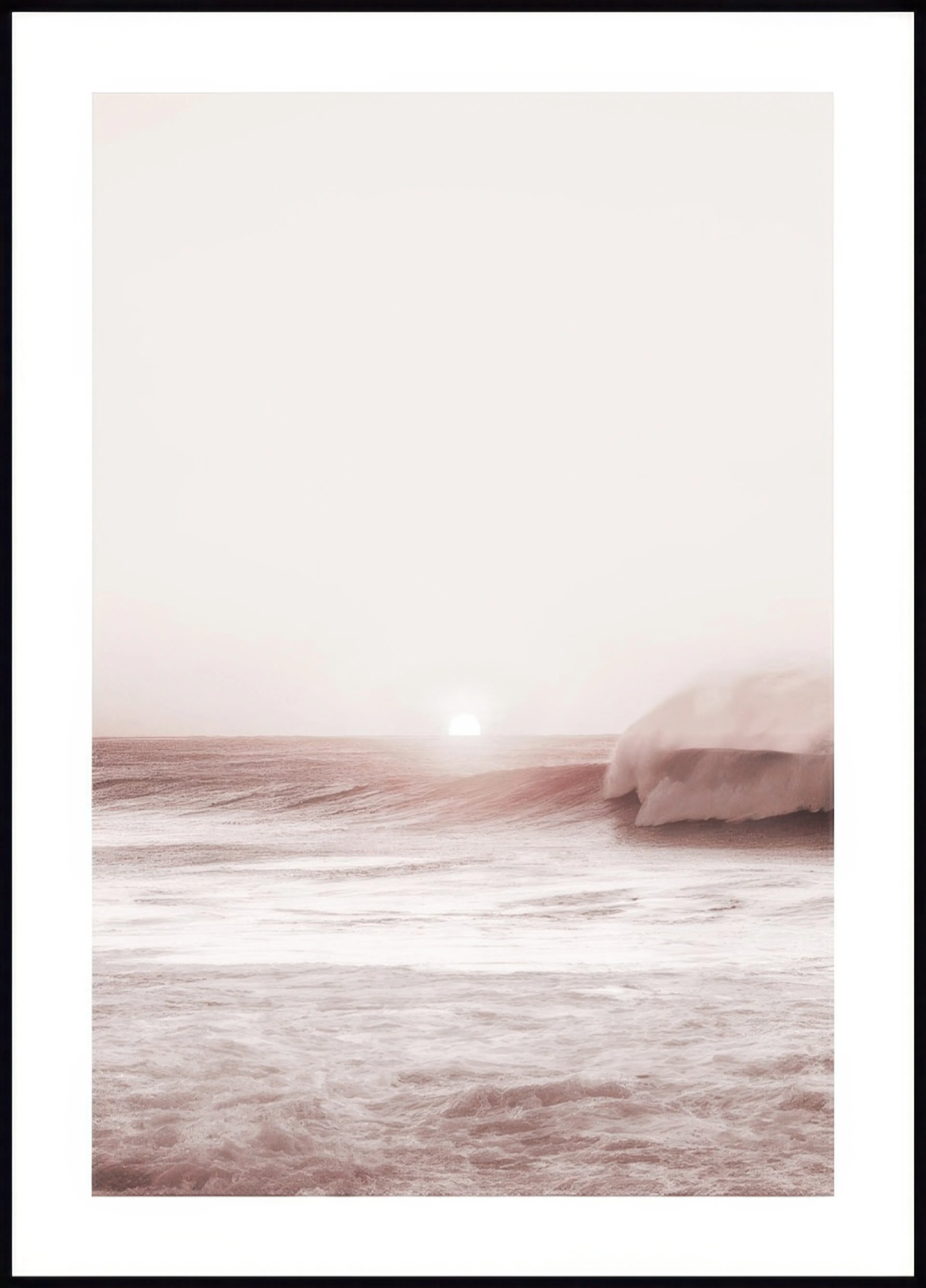 A poster featuring a sun setting over a misty ocean with a large wave breaking in the foreground.