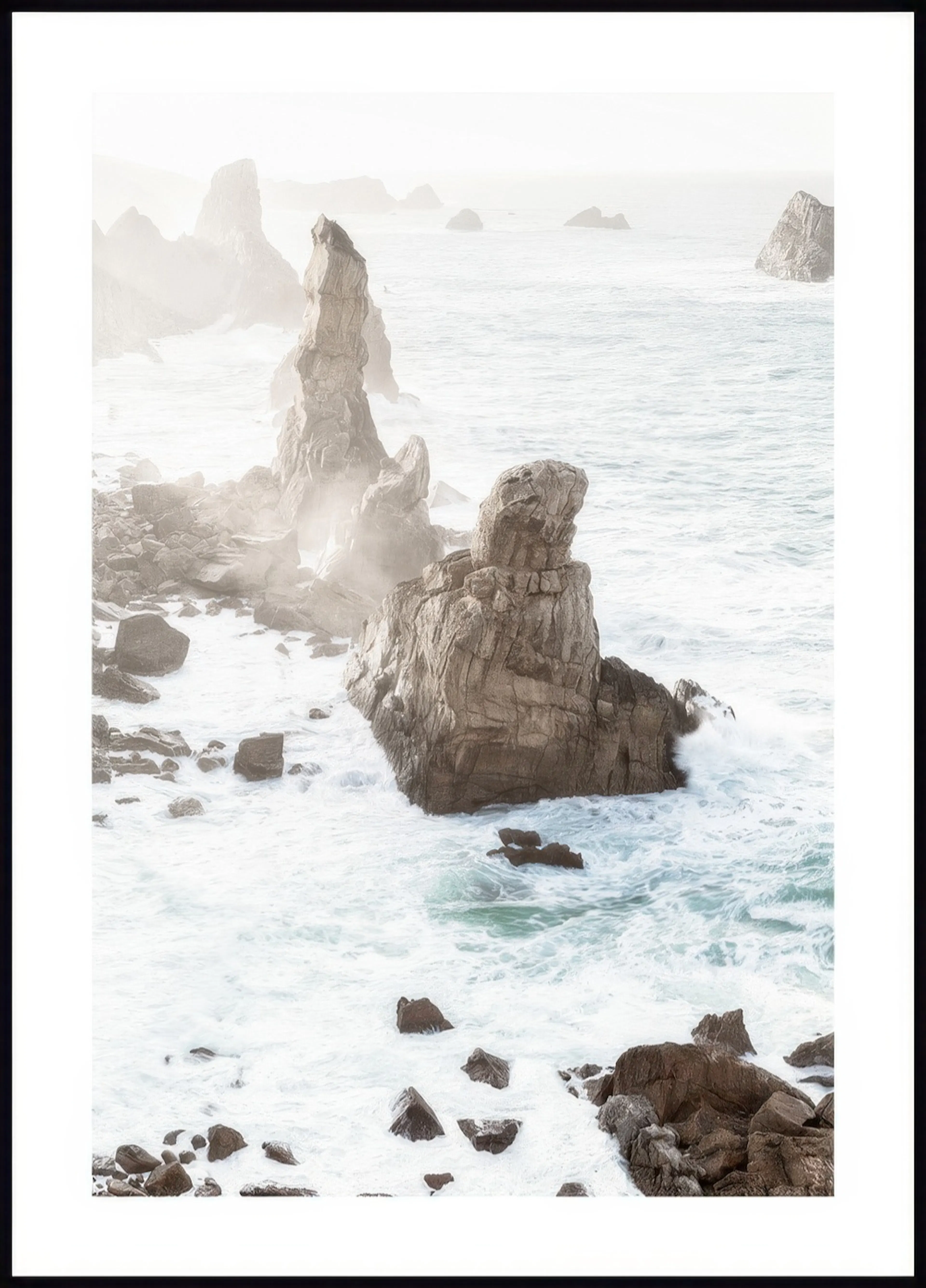 A poster depicting a misty coastal scene with large rock formations being hit by foamy ocean waves.