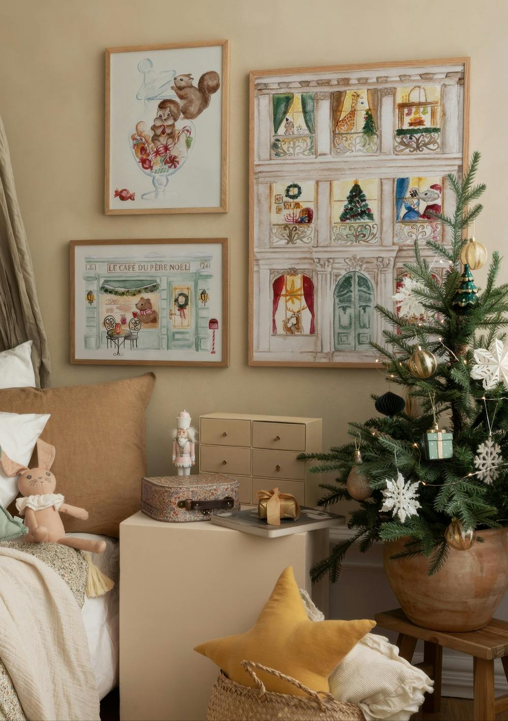 A festive Christmas poster pack featuring squirrels with candy, a cozy cafe, and an advent calendar building.