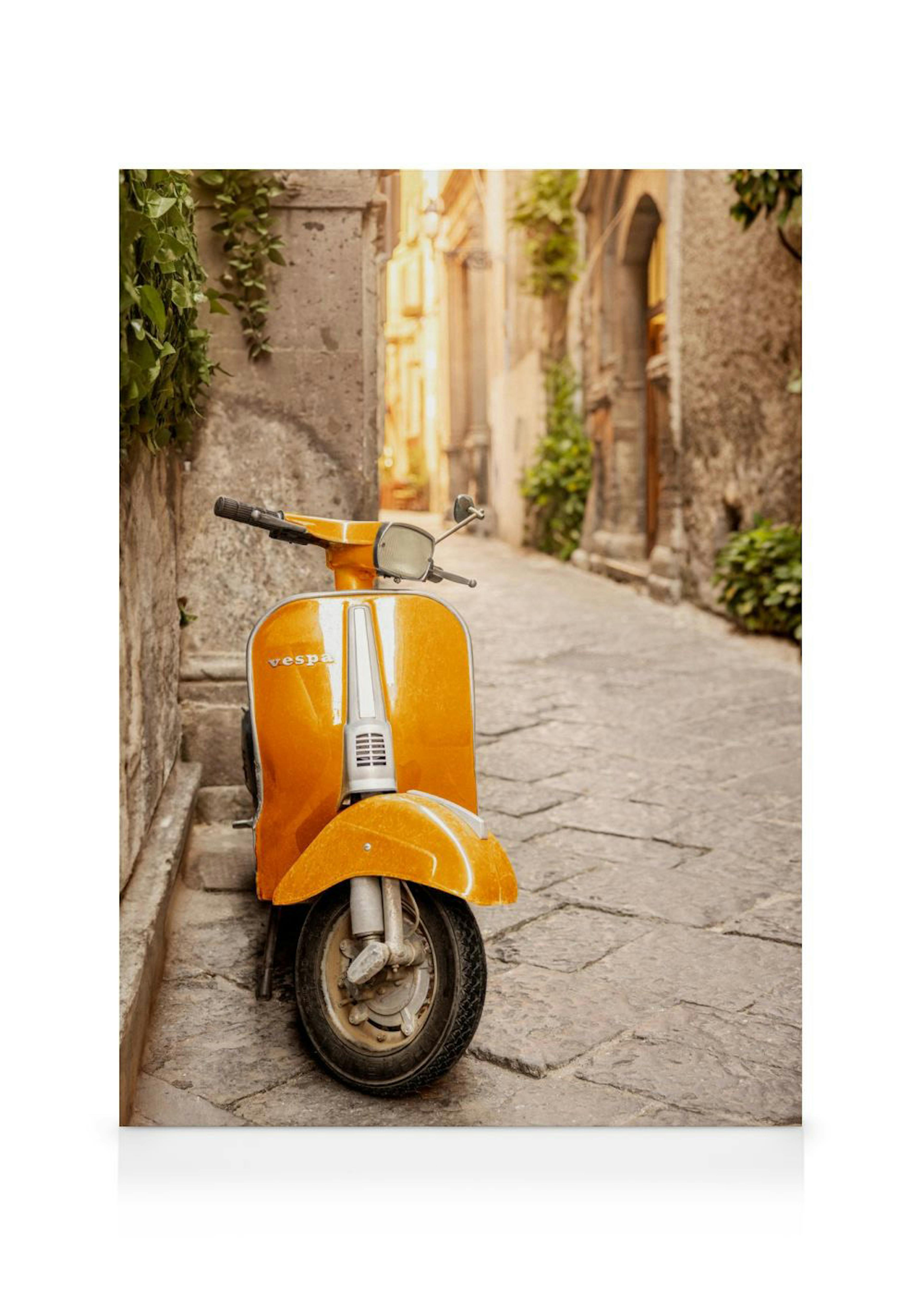 Leinwandbild einer leuchtend orangefarbenen Vespa, die in einer engen, gepflasterten Gasse im mediterranen Stil geparkt ist.