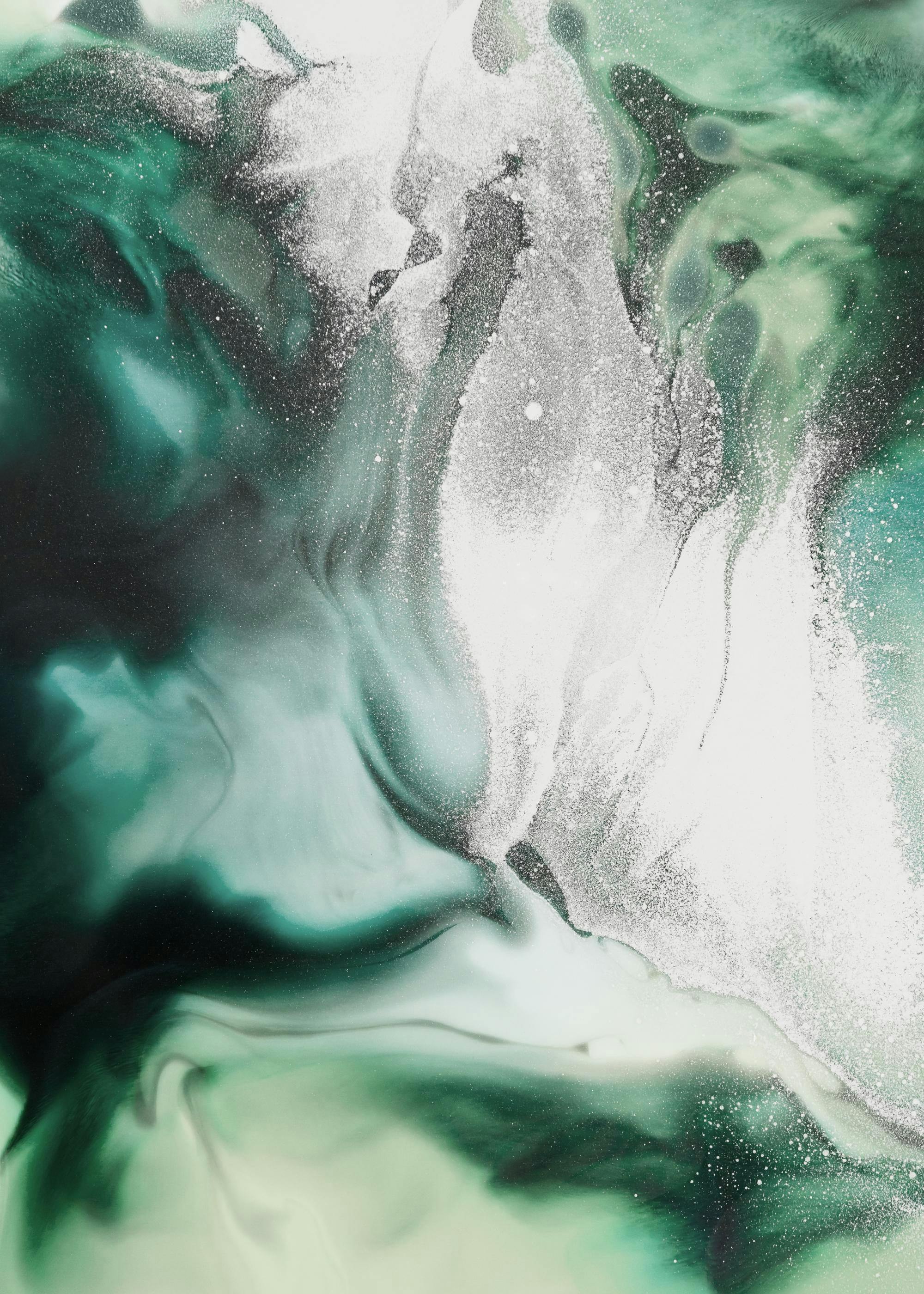 A poster featuring an abstract flow of deep teal, light green, and white colors with scattered glitter.