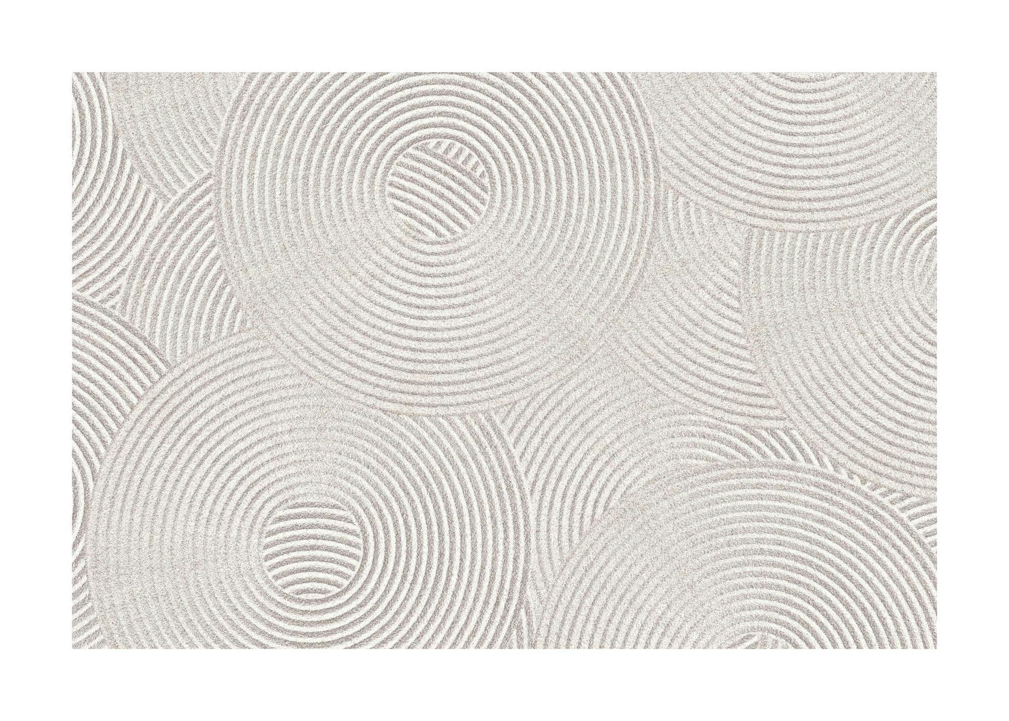 Een poster met een zen-tuin patroon van concentrische cirkels in lichtbeige zandstructuur.