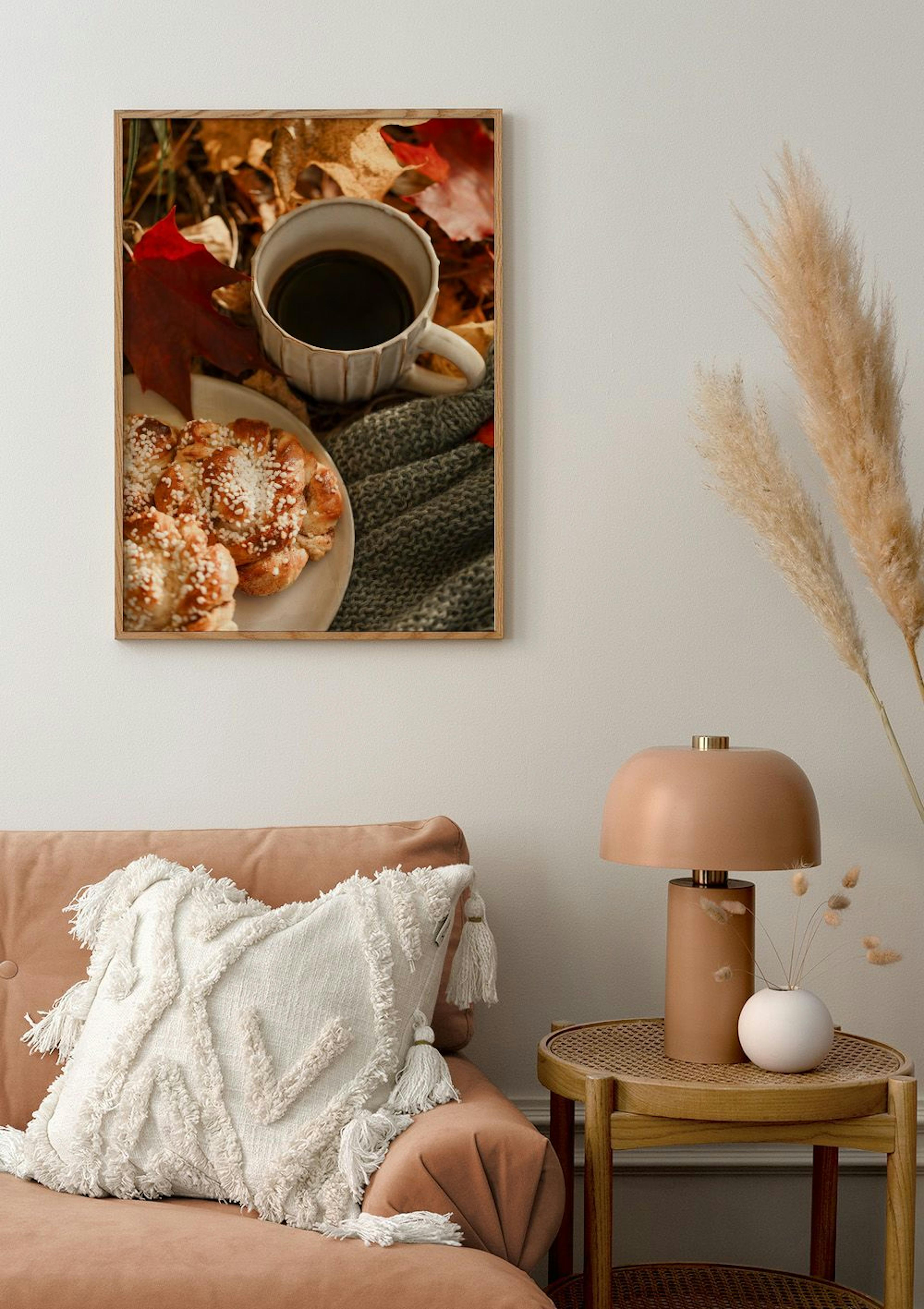 Autumn poster with coffee and sweet buns on a plate, surrounded by colourful fall leaves and a knitted blanket, hanging in a cos