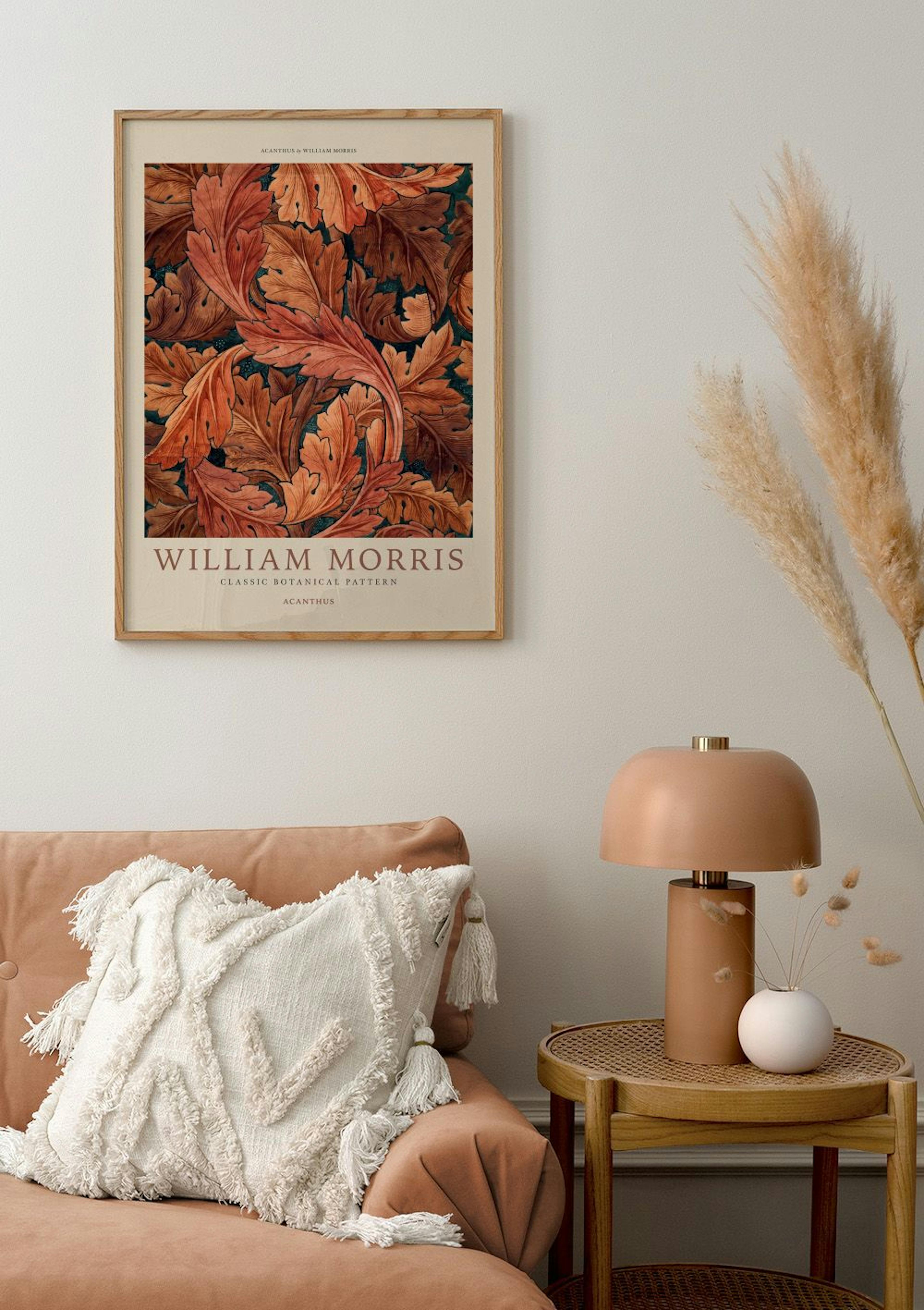 A William Morris Acanthus botanical poster with rich orange and brown leaves, displayed above a peach sofa.