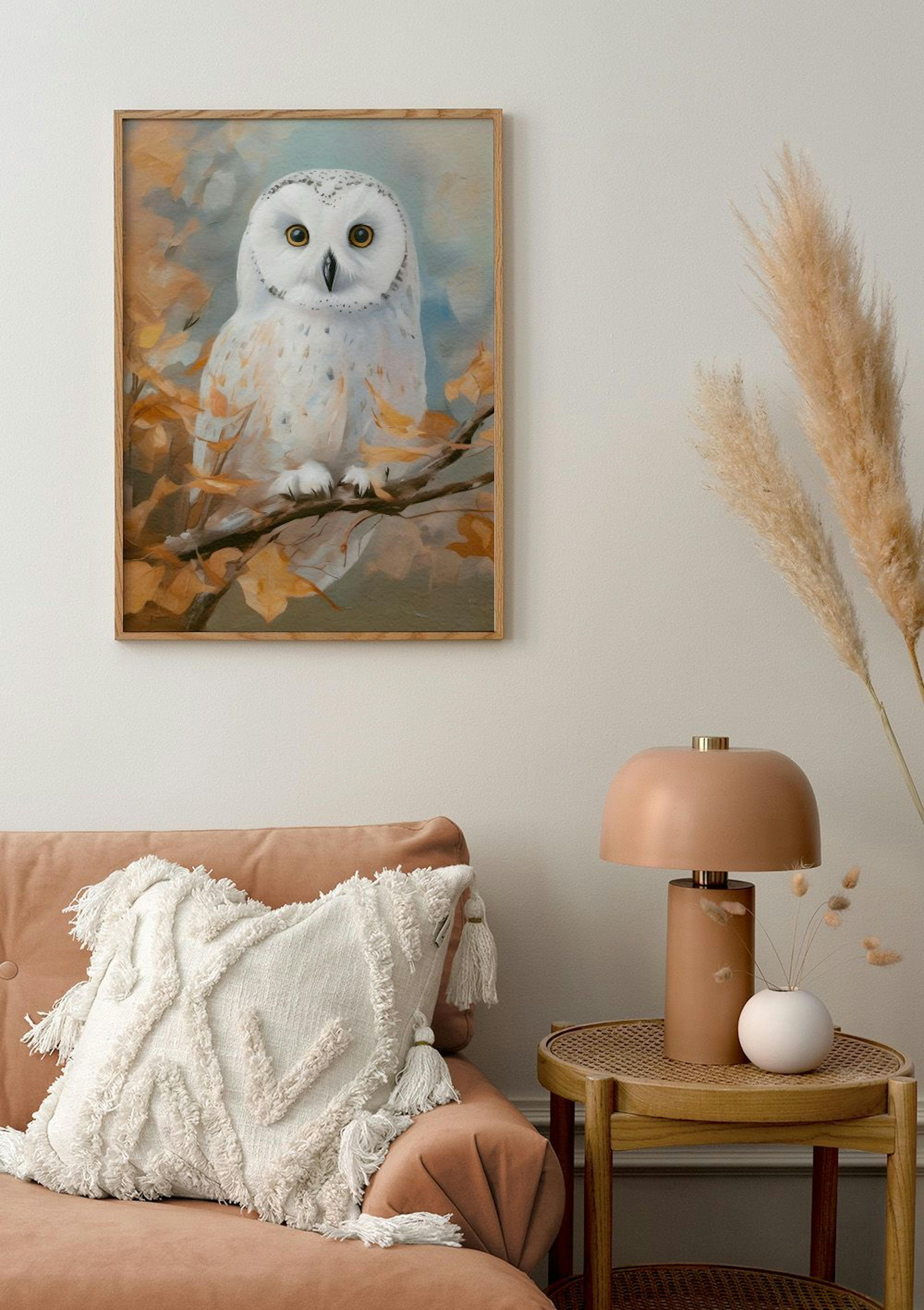 Oil painting style poster of a white snowy owl perched on a branch with autumn leaves, displayed above a sofa in a living room.