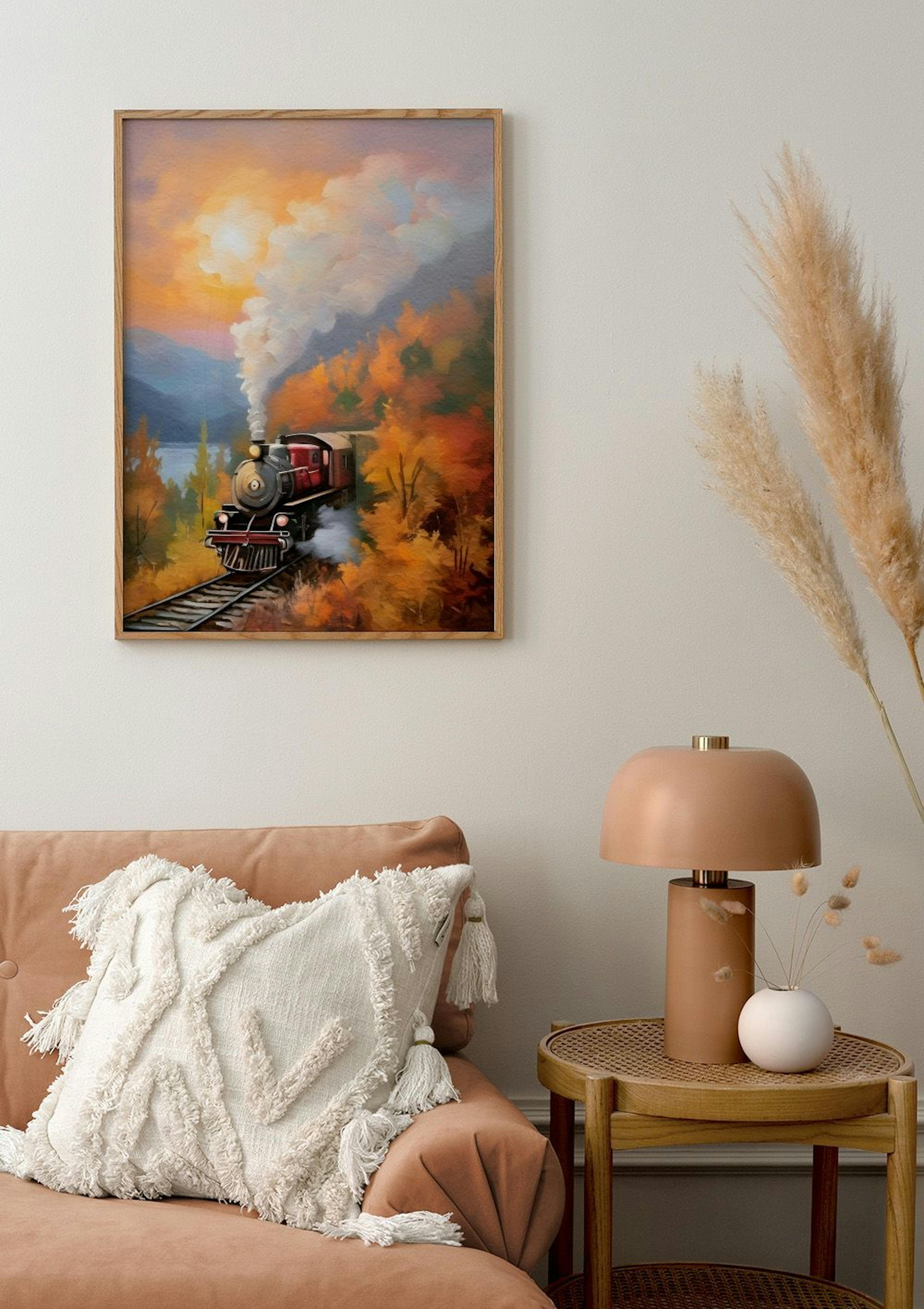 A poster of a red train on tracks, surrounded by autumn trees and a lake, displayed above a sofa in a living room.
