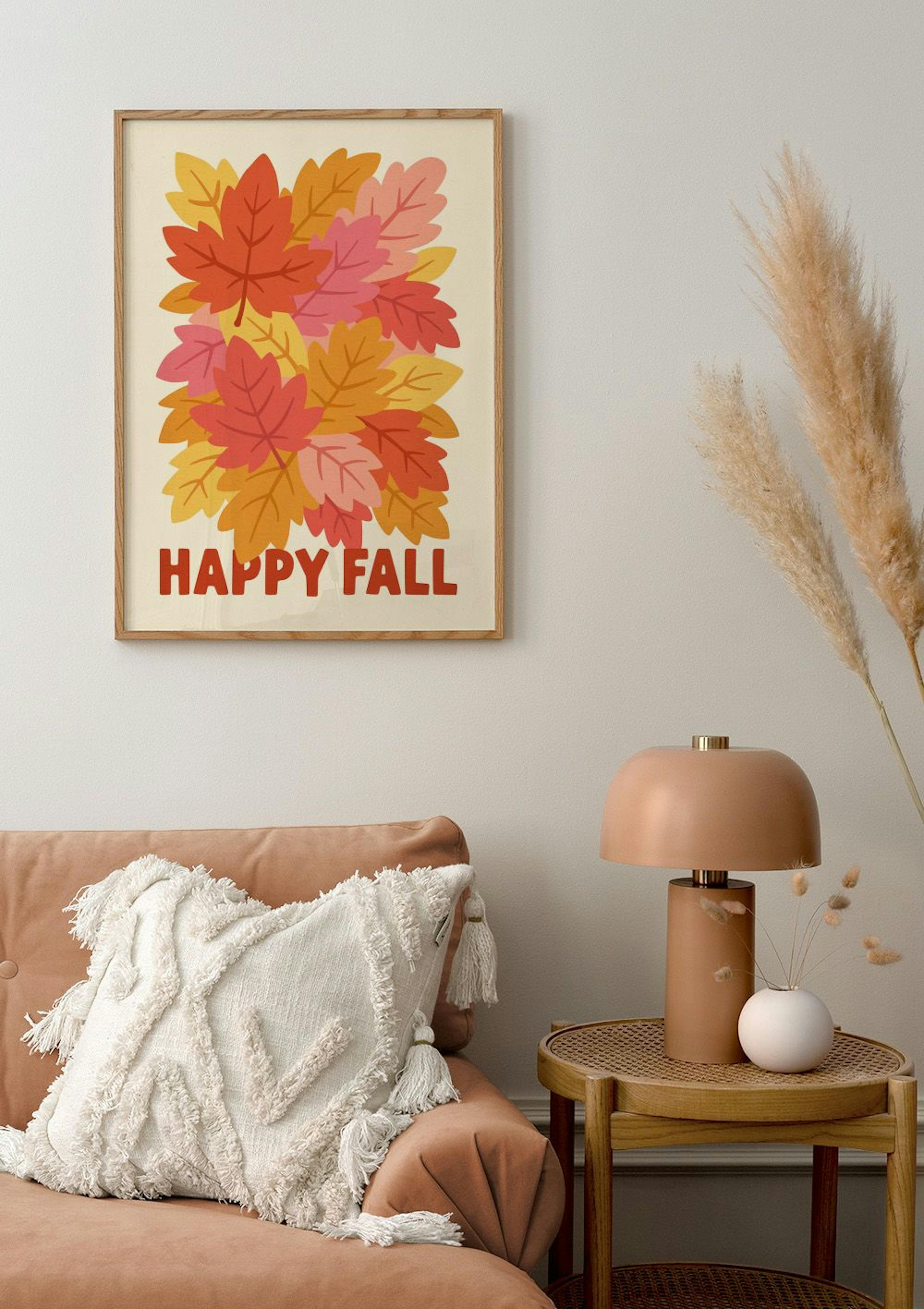 A Happy Fall poster with autumnal leaves in red, orange, yellow, and pink, displayed above a rust-coloured sofa in a living room