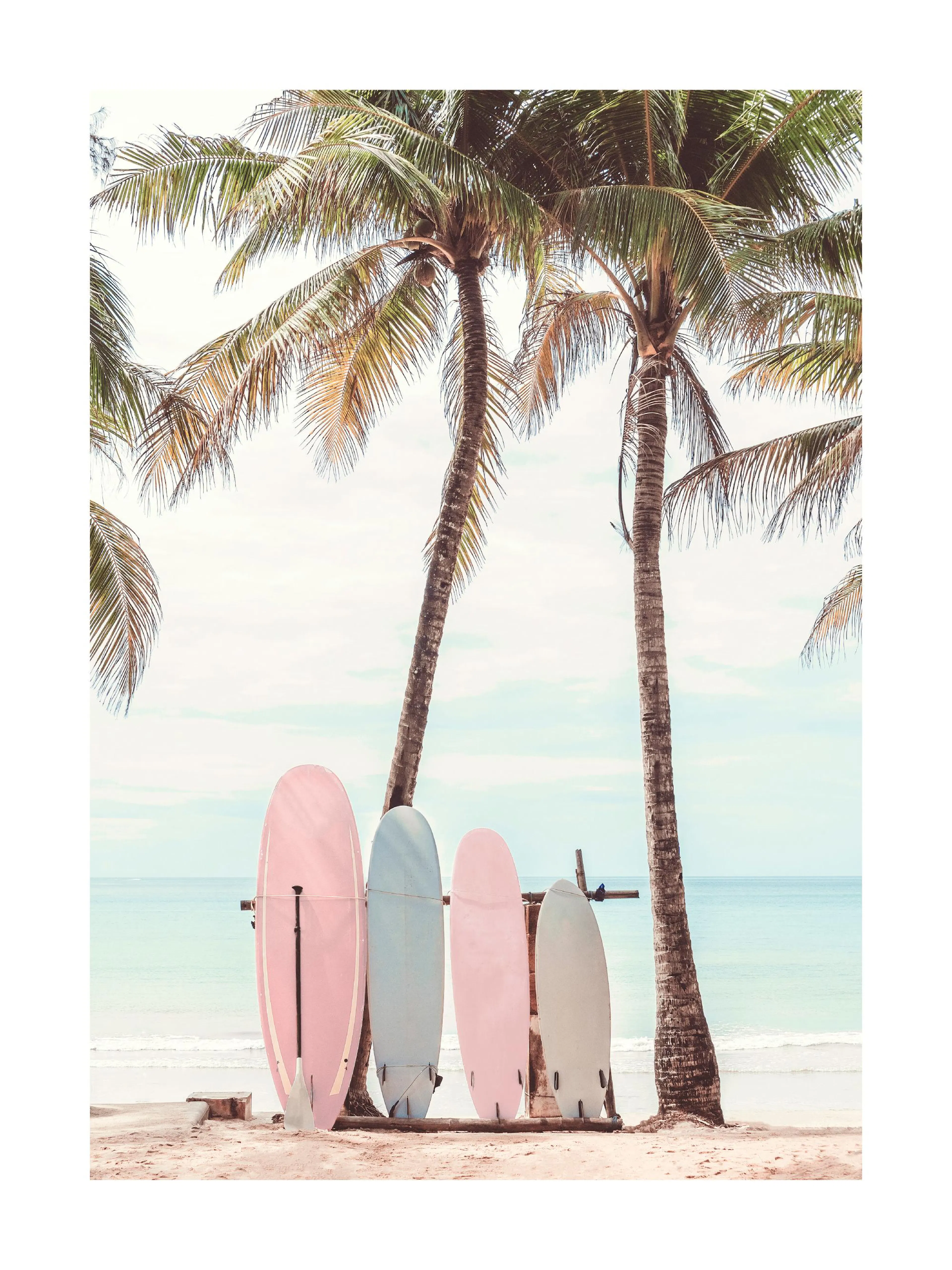 A poster featuring a row of colorful surfboards, including pink and blue, leaning against palm trees on a sandy beach.