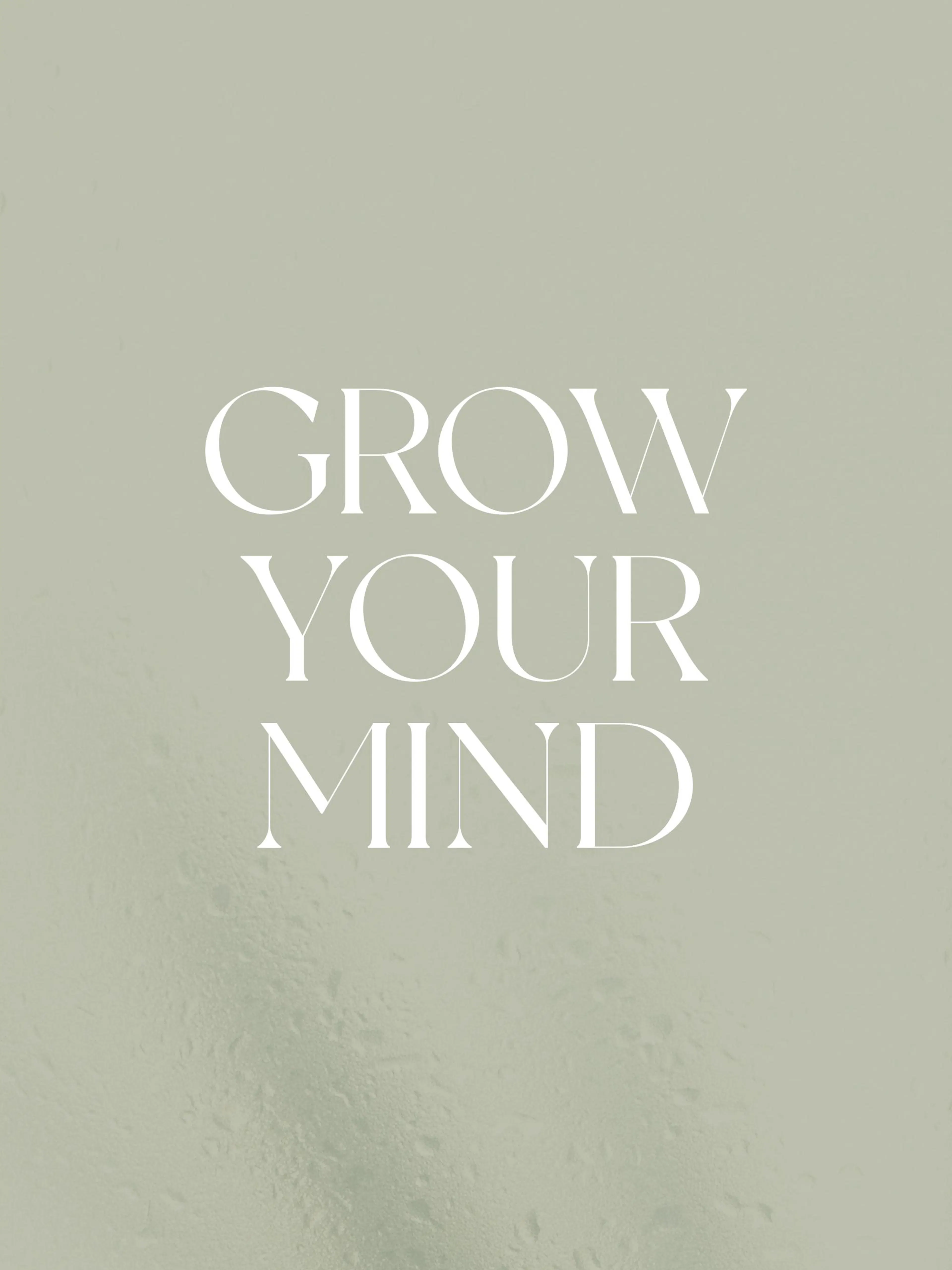A poster with the words GROW YOUR MIND in white serif font on a light sage green background with a subtle textured appearance.