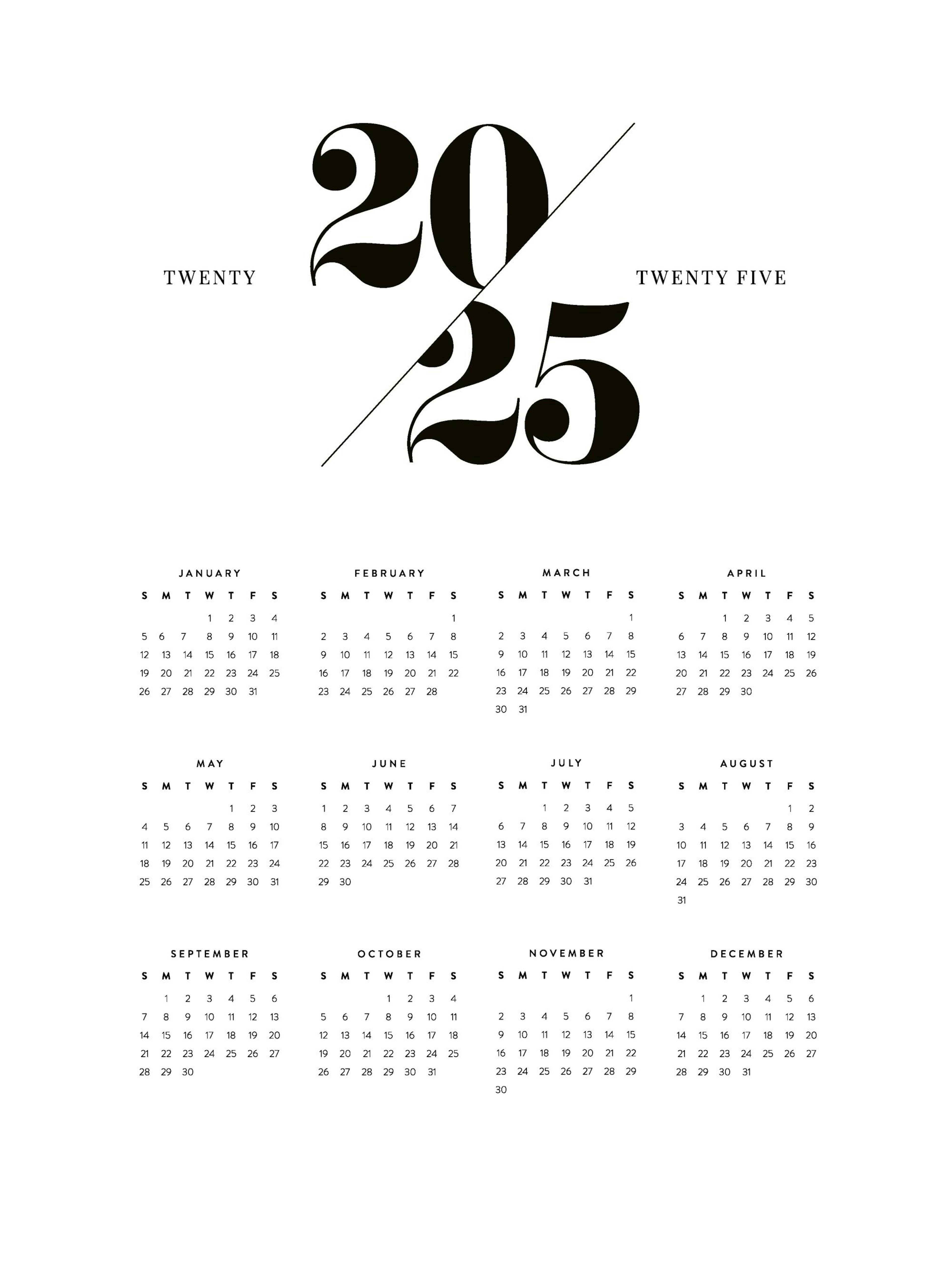 A 2025 calendar poster with a bold black and white font, hanging above a dark grey armchair in a modern living room.