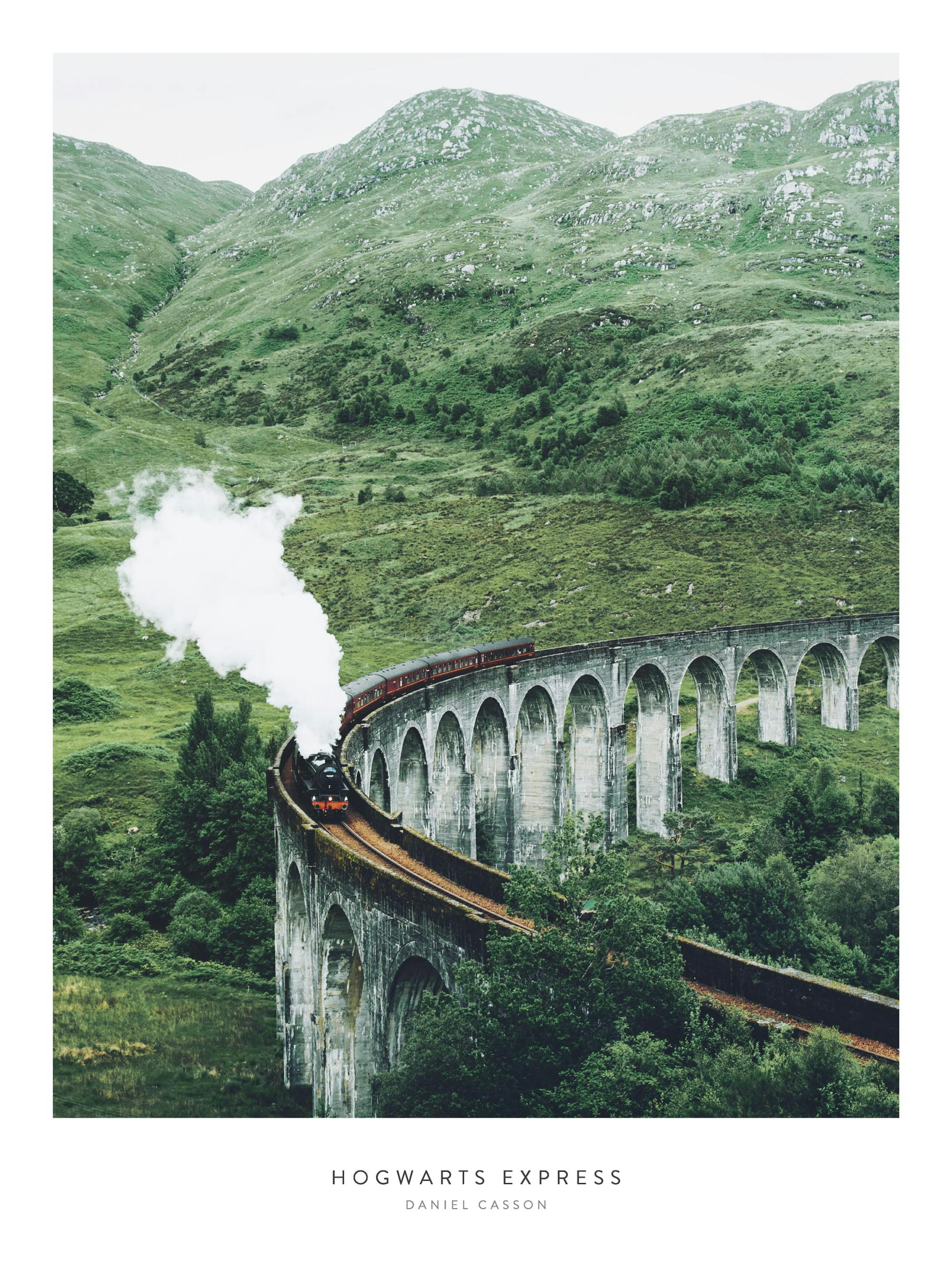 A poster featuring the Hogwarts Express steam train on a viaduct with arches, surrounded by lush green mountains and trees.