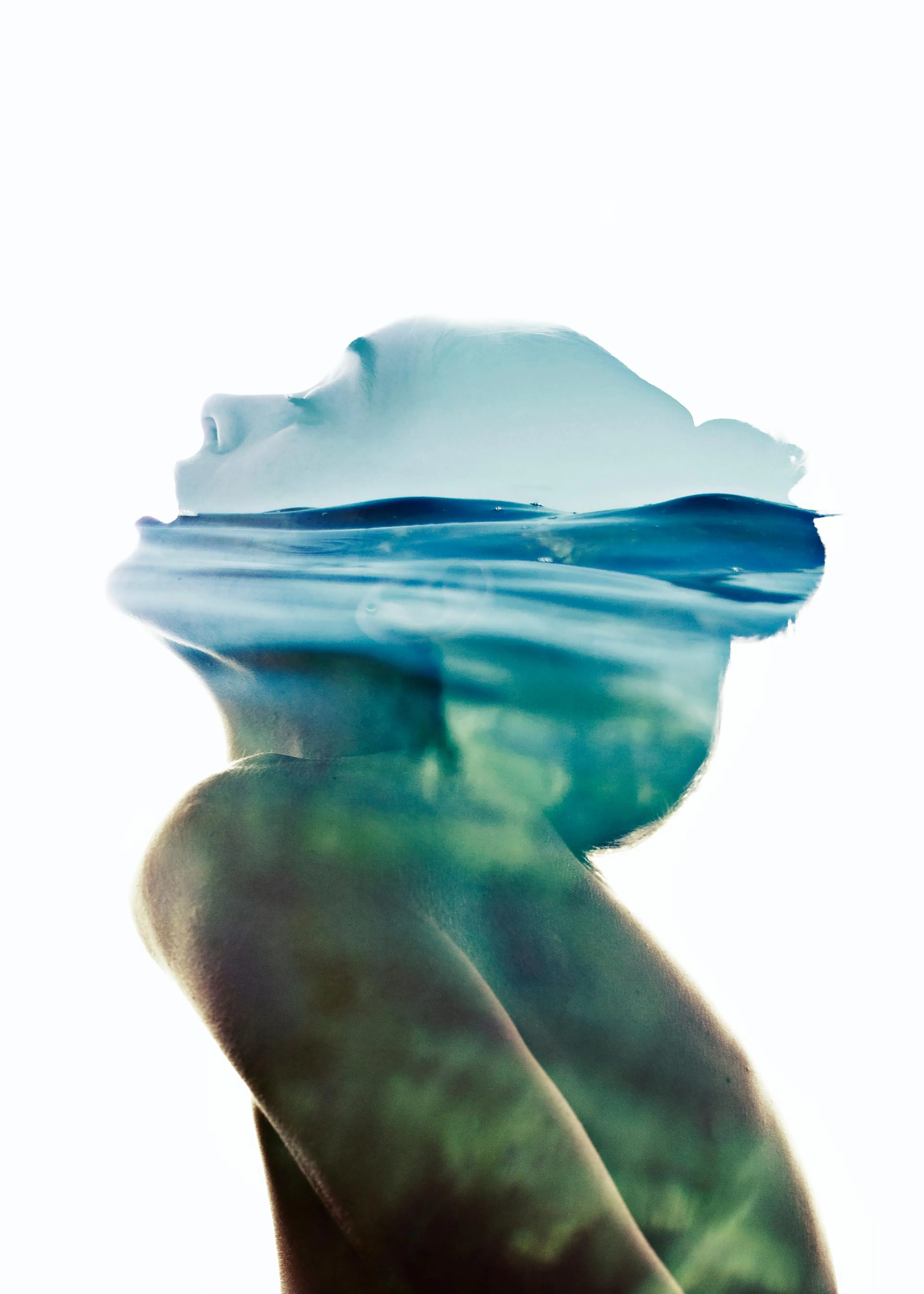 A poster featuring a double exposure of a persons head submerged in water, with blue and green tones.